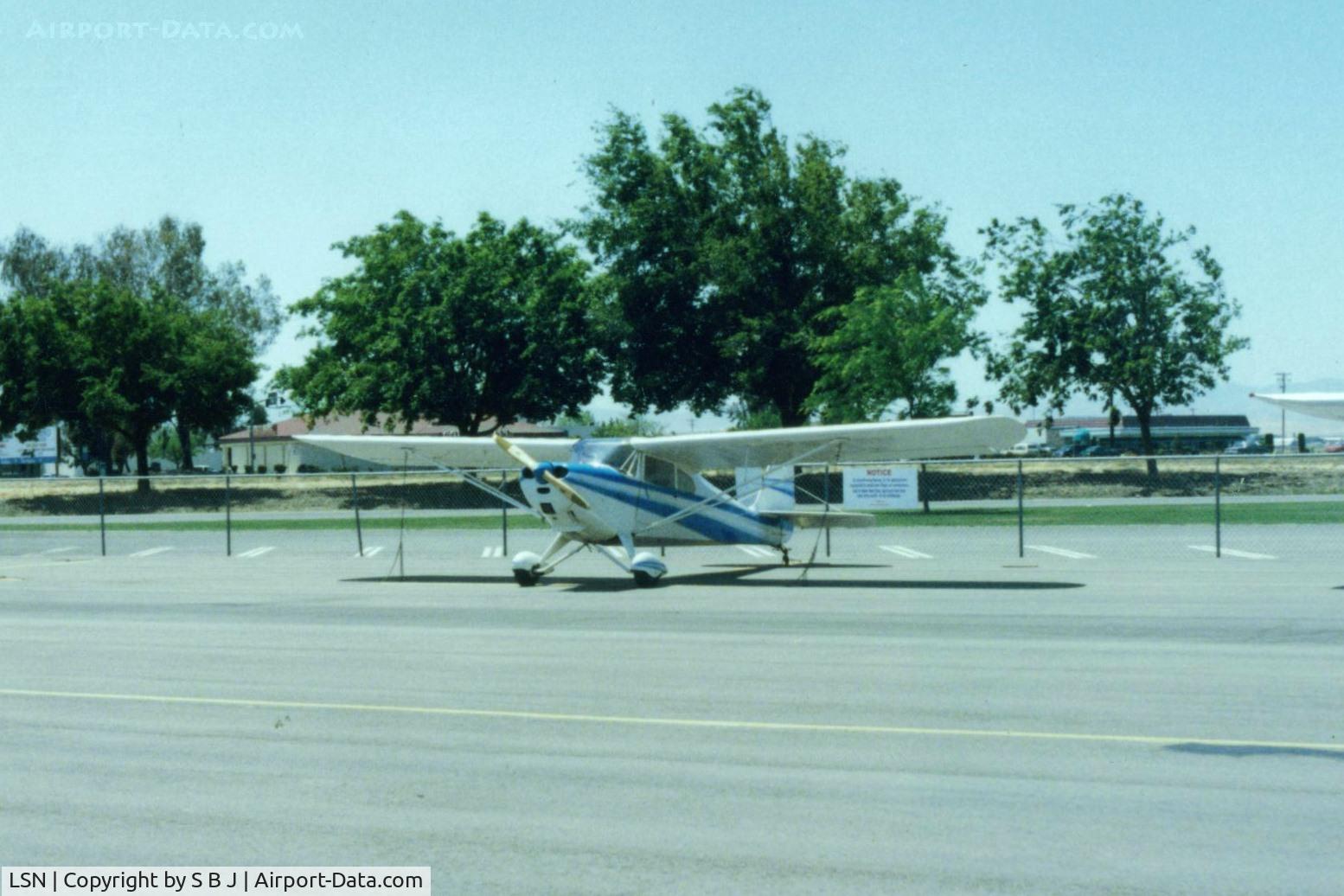 Los Banos Municipal Airport (LSN) - 78E at Los Banos and why it was a frequent stop.The close proximity of many eating establishments that are seen behind 78E. Its a rare airport that has this feature! McDonalds on left and Ryans which is now Black Bear Diner on right & many others..