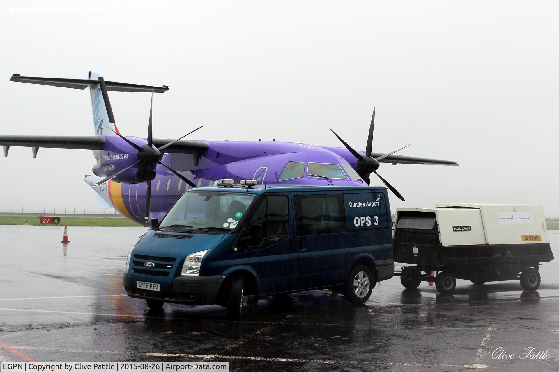 Dundee Airport, Dundee, Scotland United Kingdom (EGPN) - Ramp activity at a very wet and overcast Dundee Riverside Airport EGPN