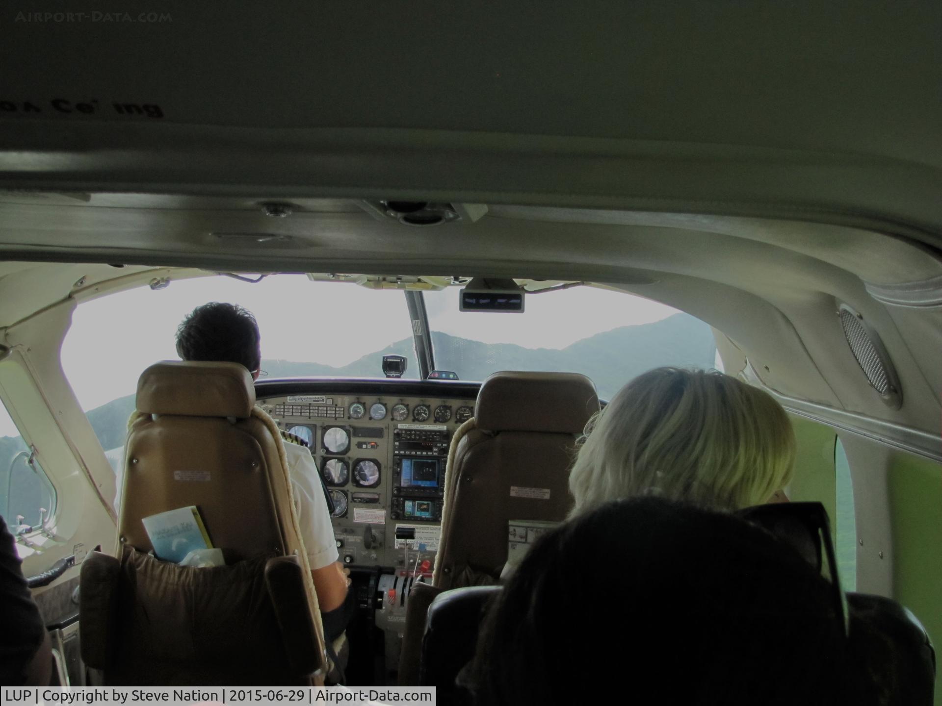Kalaupapa Airport (LUP) - Cabin shot of Makani Kai Air Cessna 208B climbing out of Kalaupapa Airport, Molokai, HI for 5 minute flight to Molokai Topside Airport (MKK)