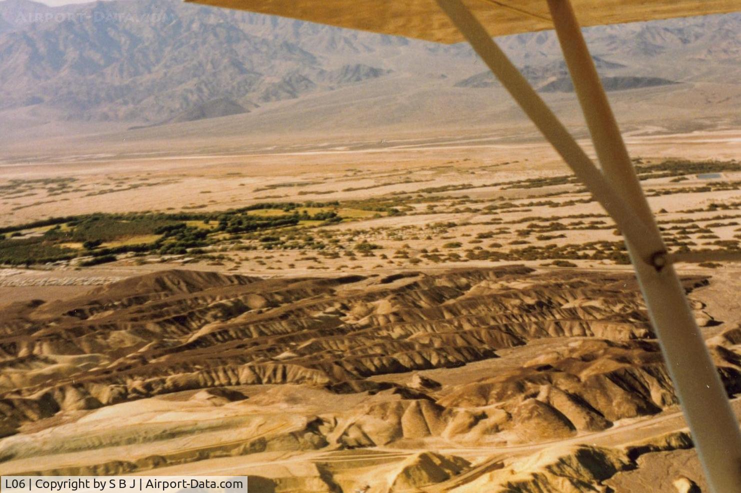 Furnace Creek Airport (L06) - Furnace Creek looking to the SW. Airport is seen at the top of the wing strut.