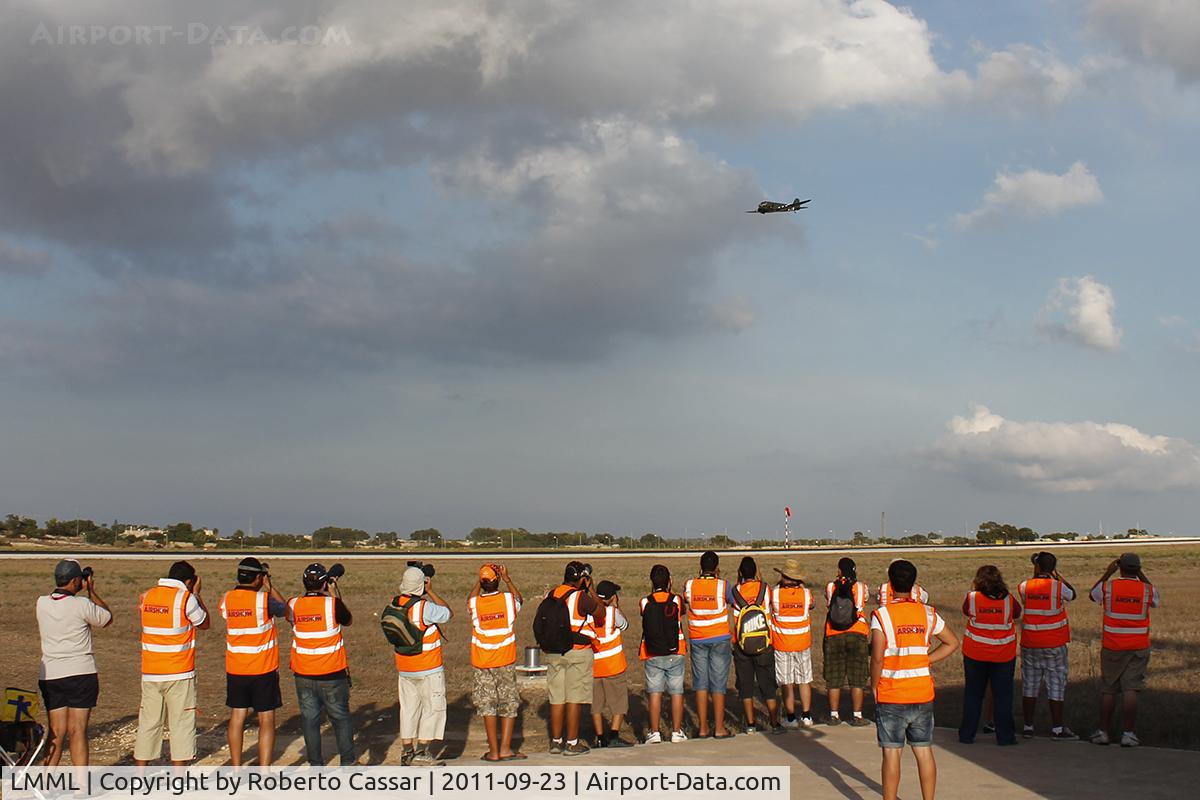 Malta International Airport (Luqa Airport), Luqa Malta (LMML) - Volunteers for the Malta International Airshow 2011 are treated to a day at the approach of the active runway to shoot the participants upon landing