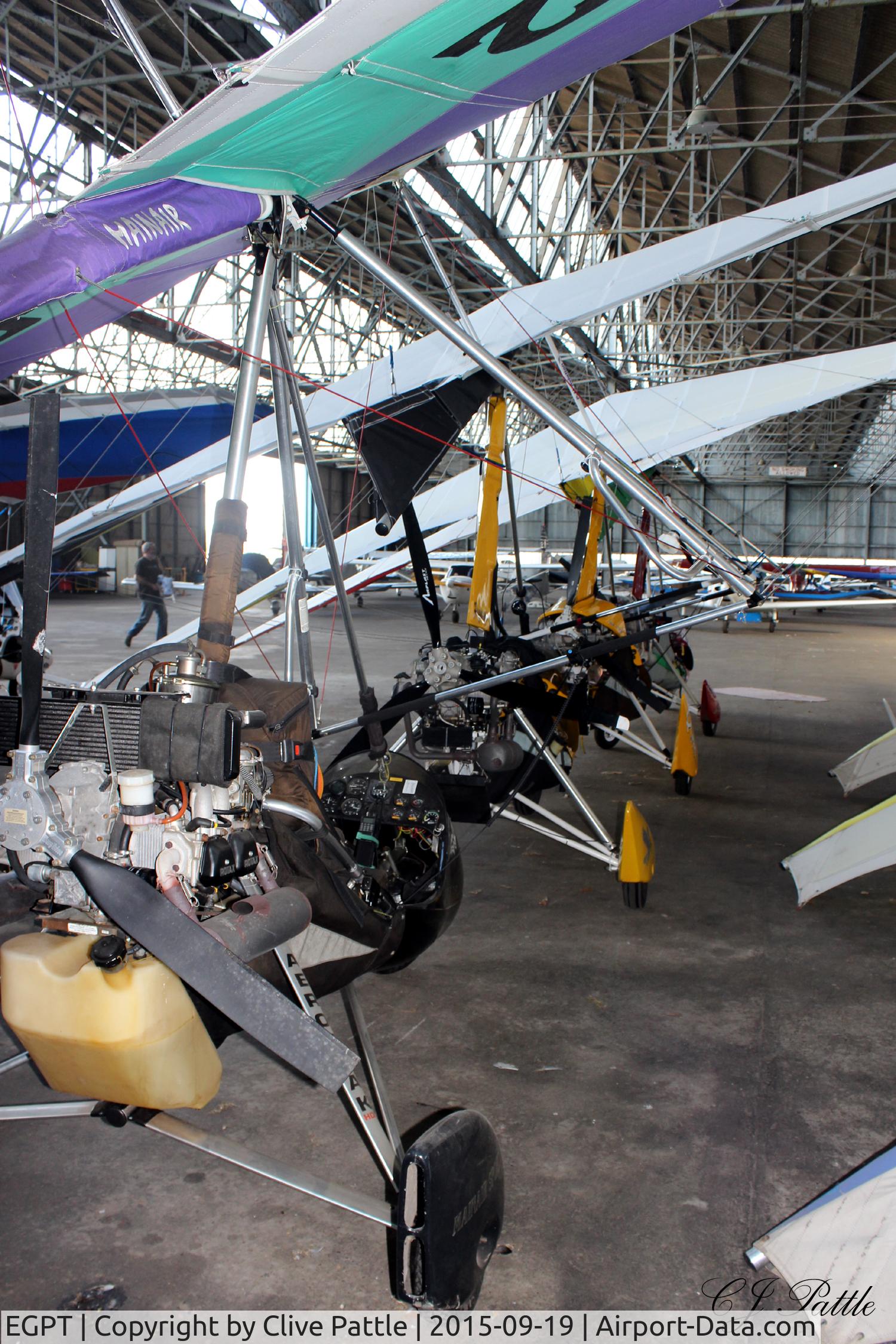 Perth Airport (Scotland), Perth, Scotland United Kingdom (EGPT) - A clump of microlights hangared at Perth (Scone) EGPT - note the WWII built trellis construction of the hangar roof.
