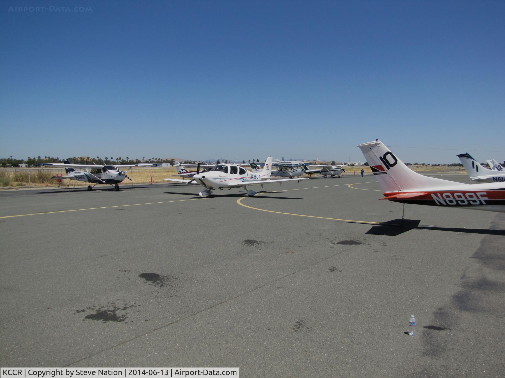 Buchanan Field Airport (CCR) - Another shot of the 2014 Air Race Classic flightline showing Jacksonville University Cirrus SR20 N486DA #7 arriving with Cessna 182K N899F #10, Cessna R182 N614WM #11 & Cessna 182T N935FA #12 nearest