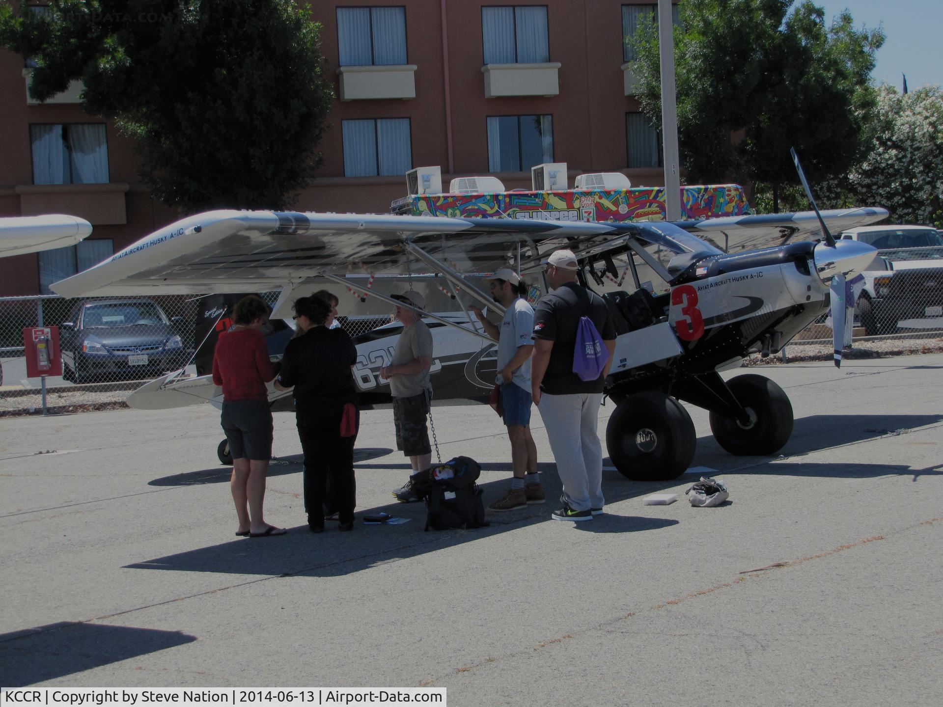 Buchanan Field Airport (CCR) - 2014 Air Race Classic officials check out Aviat A-1C-200 N462WC #23 on the flightline prior to the cross country race. Everything was OK!
