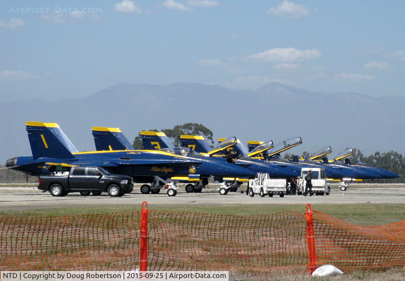 Point Mugu Nas (naval Base Ventura Co) Airport (NTD) - Five Blue Angels F/A-18C Hornets single seat with one F/A-18D Hornet dual seat (Tail #7) aligned on display-practice day for the weekend airshow at NTD. Two General Electric F404-GE-402 turbofans. Max speed Mach 1.8