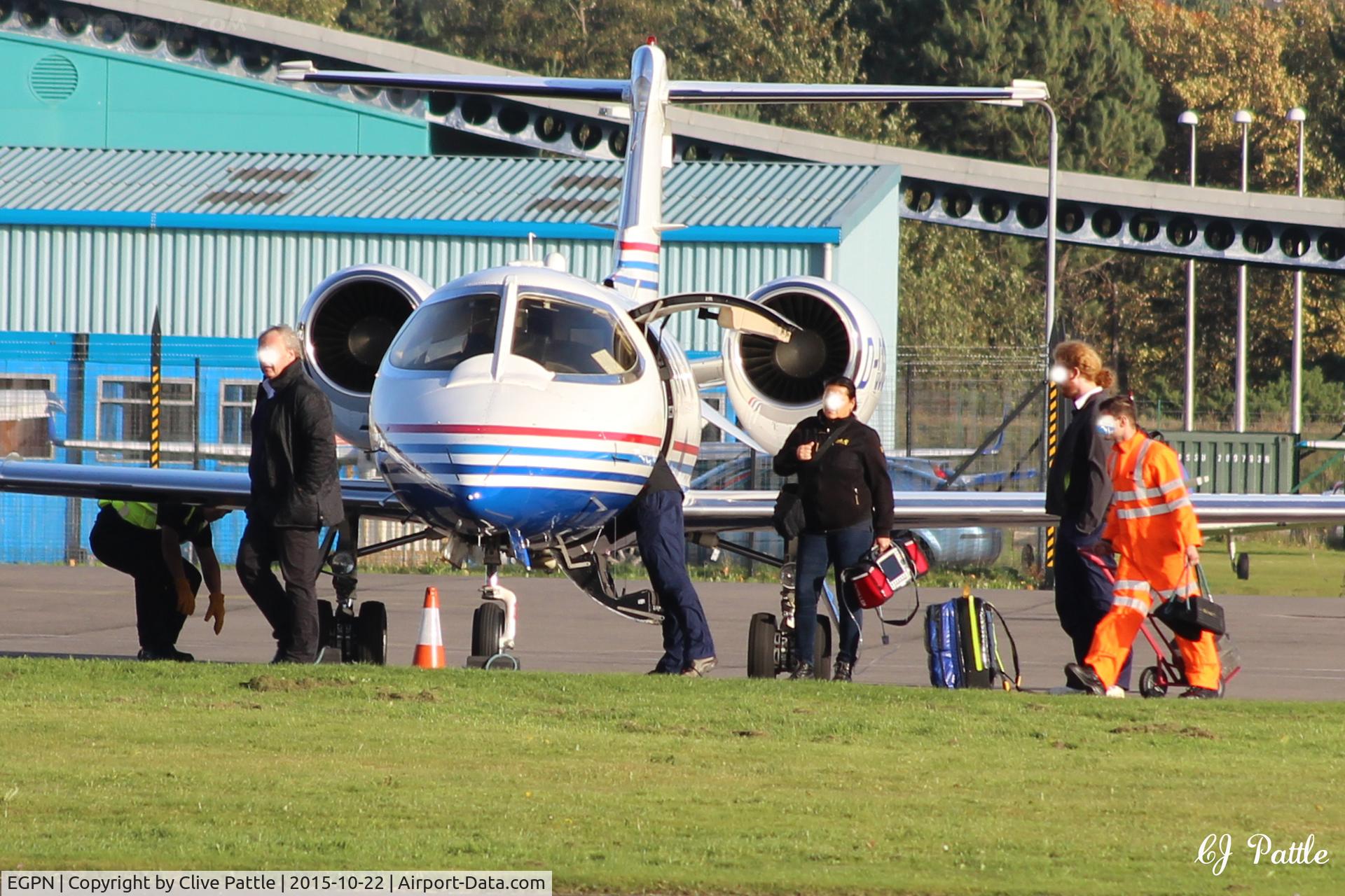 Dundee Airport, Dundee, Scotland United Kingdom (EGPN) - Groundcrew retrieve chocks whilst passengers and crew load onto a visiting LJ31A at Dundee Riverside Airport EGPN