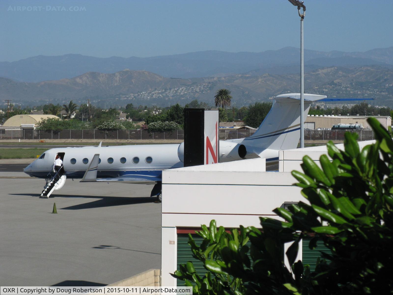 Oxnard Airport (OXR) - N900AL 2014 Gulfstream Aerospace GV-SP (G550) of Abbott Labs refueled at OXR's heavies Fuel Dock ramp. Aircraft is turning and burning at idle with pilot reentering cockpit. Also see another photo in Aircraft section.