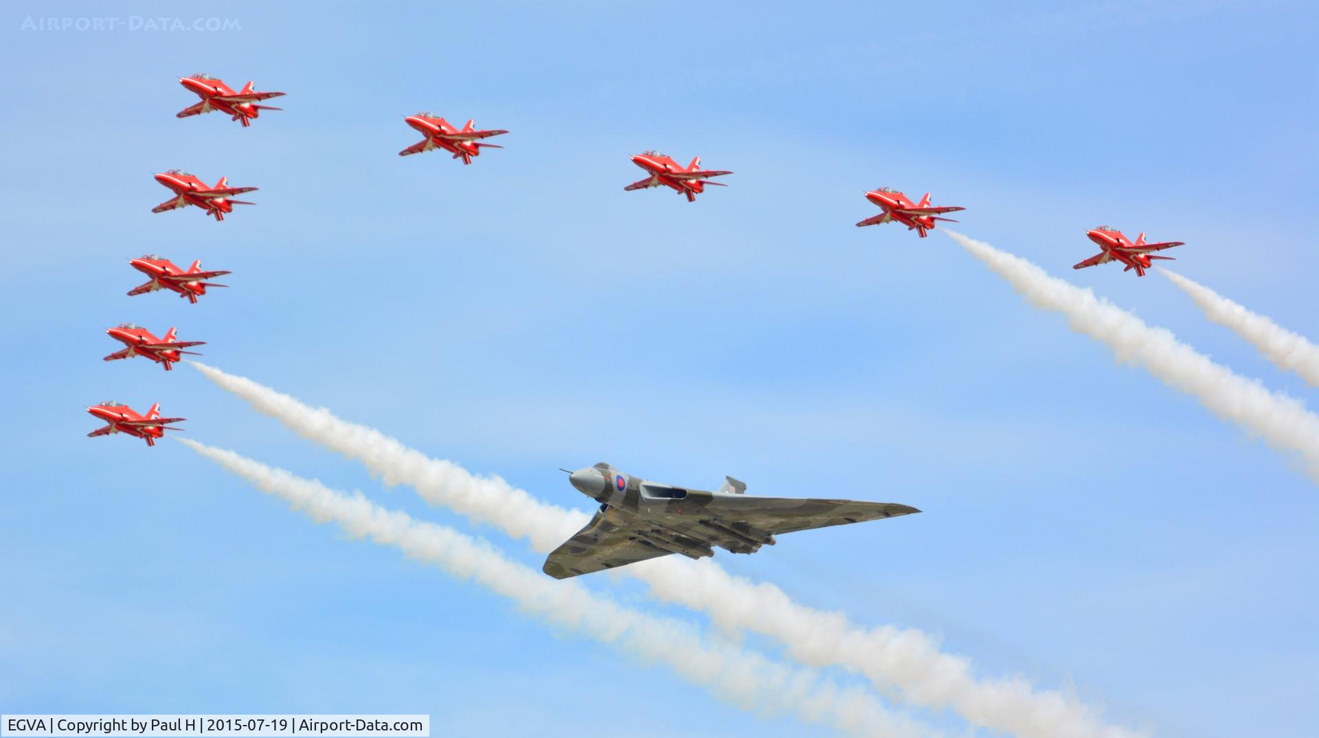 RAF Fairford Airport, Fairford, England United Kingdom (EGVA) - Formation flight of the Red Arrows with XH558 Avro Vulcan at RIAT 2015