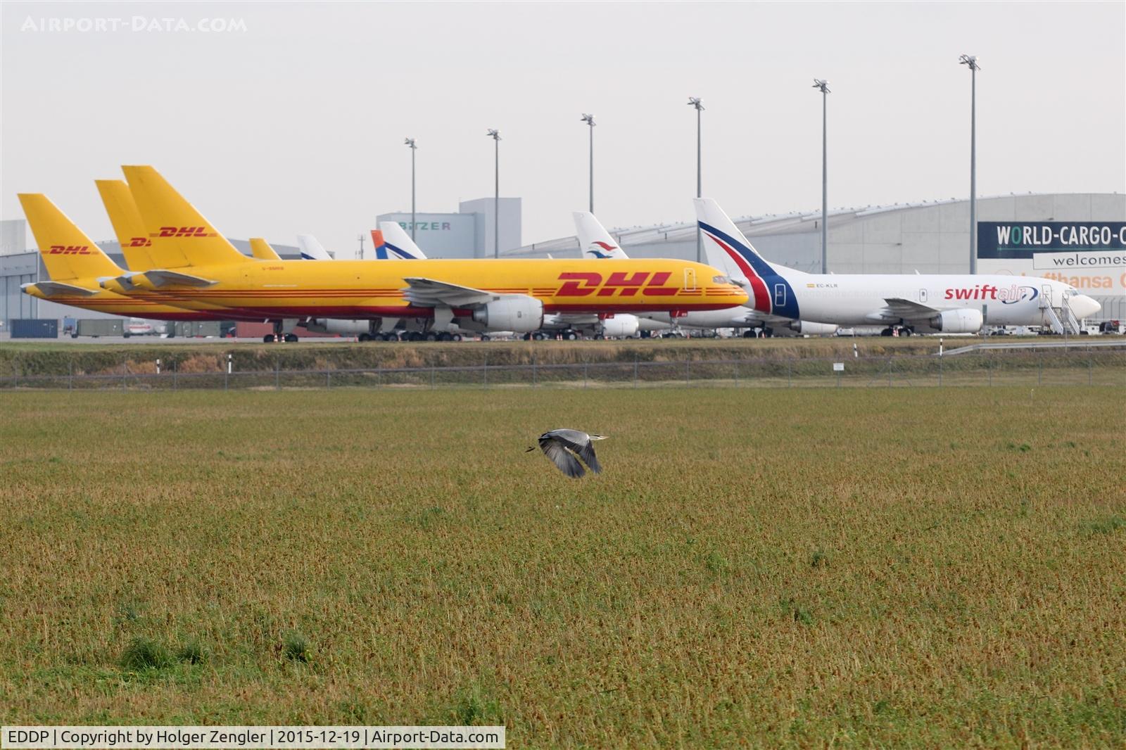 Leipzig/Halle Airport, Leipzig/Halle Germany (EDDP) - Crane passes plane(s) at apron 2....
