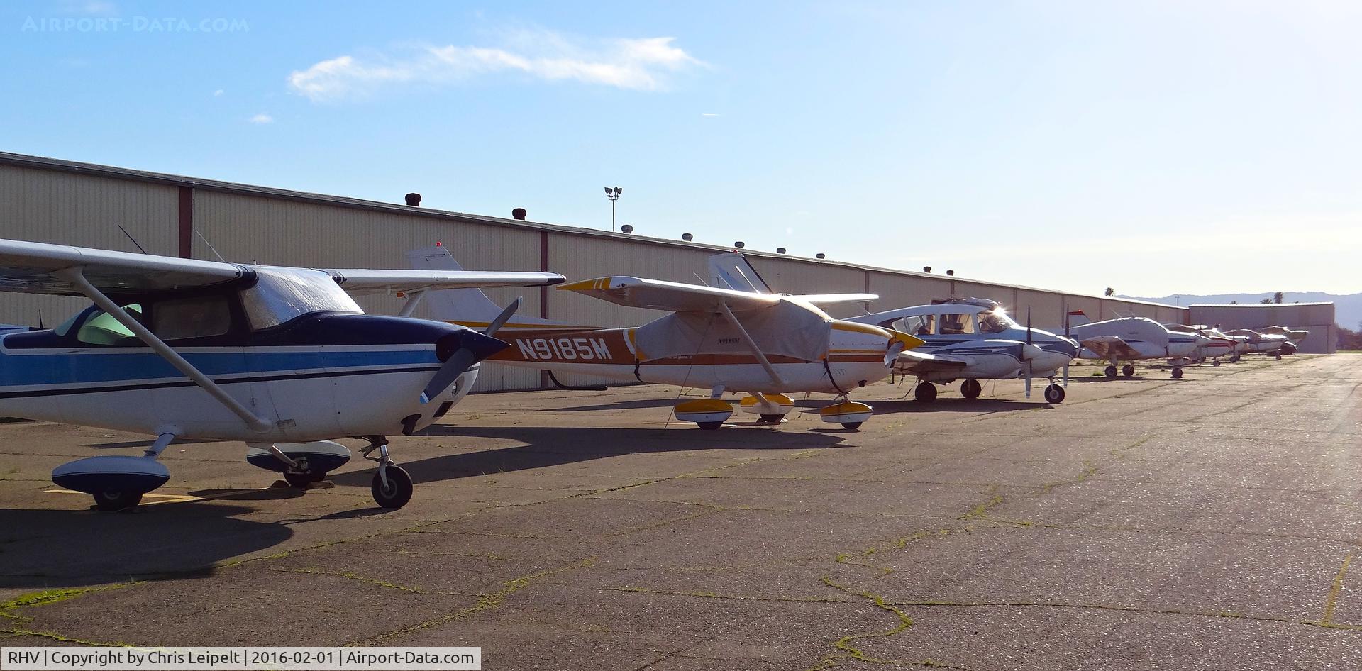 Reid-hillview Of Santa Clara County Airport (RHV) - This is the busiest you'll ever see this row of tie downs at Reid Hillview Airport. A lot of the aircraft seen here are in a temporary tie down to make room for all the transient Super Bowl 50 aircraft, however some normally park on this row.