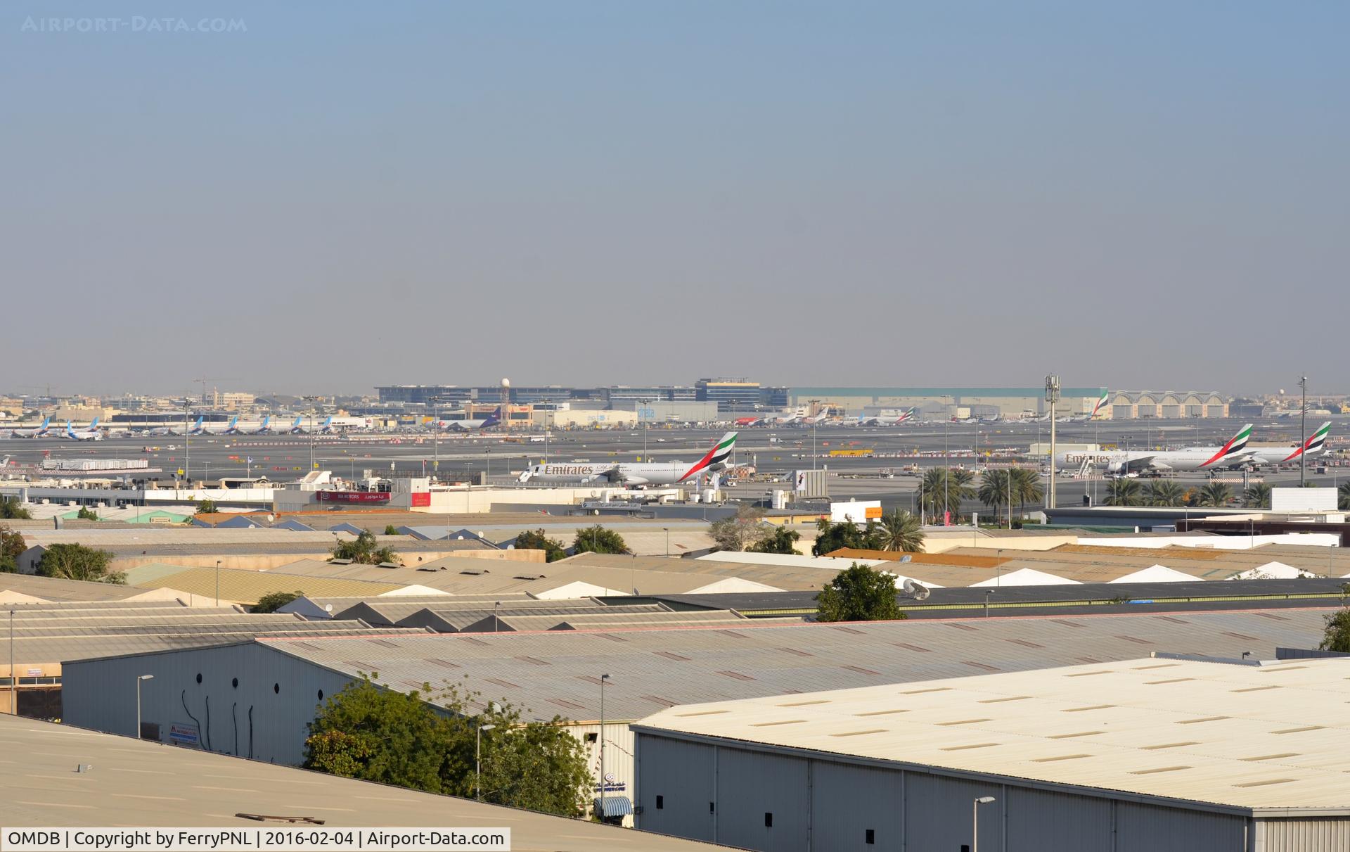 Dubai International Airport, Dubai United Arab Emirates (OMDB) - Overview of the nothern side of DXB. From left to right you see a passenger terminal, freight terminal, GA terminal maintance area.