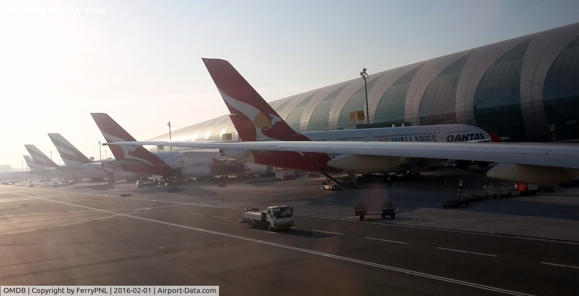 Dubai International Airport, Dubai United Arab Emirates (OMDB) - Pulling into our gate in DXB next to the Wallabies A388 of QF.