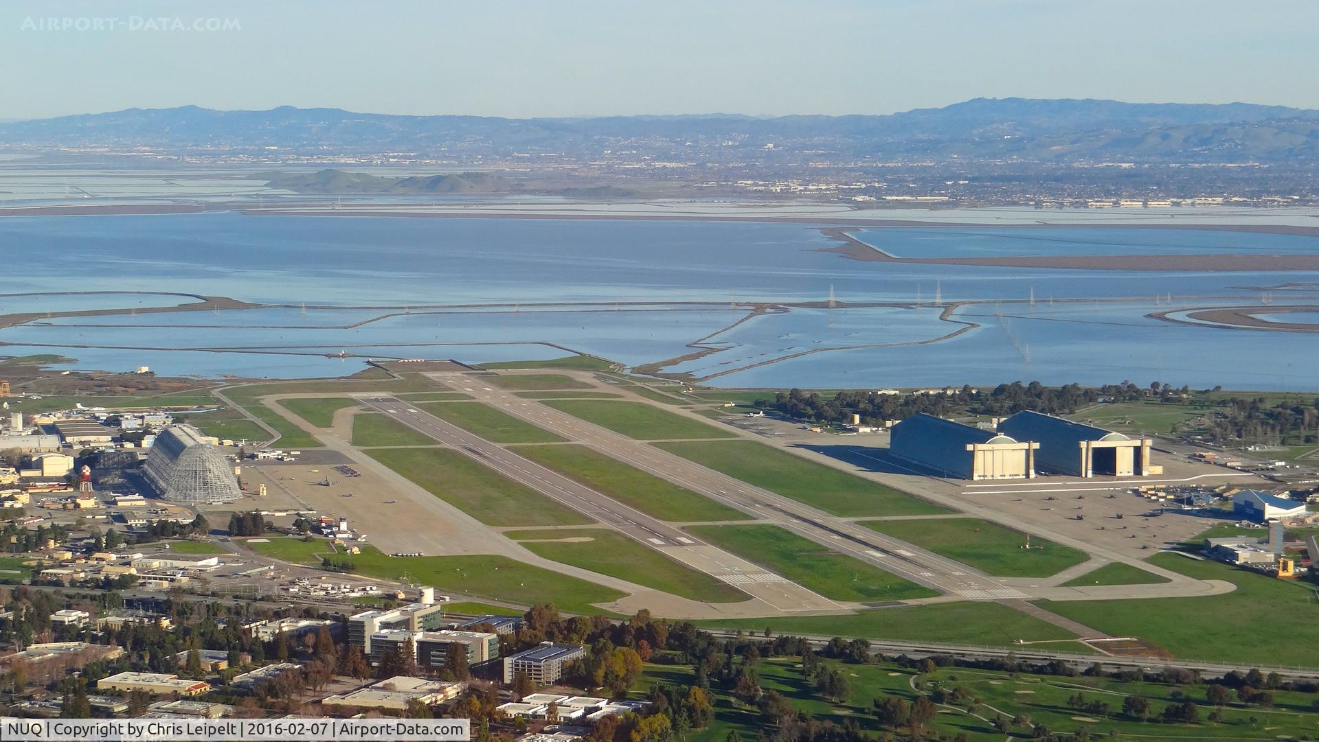 Moffett Federal Afld Airport (NUQ) - Flying over Moffett Federal Airfield, Mountain View, CA with the Blue Angels parked on the left side of the image.