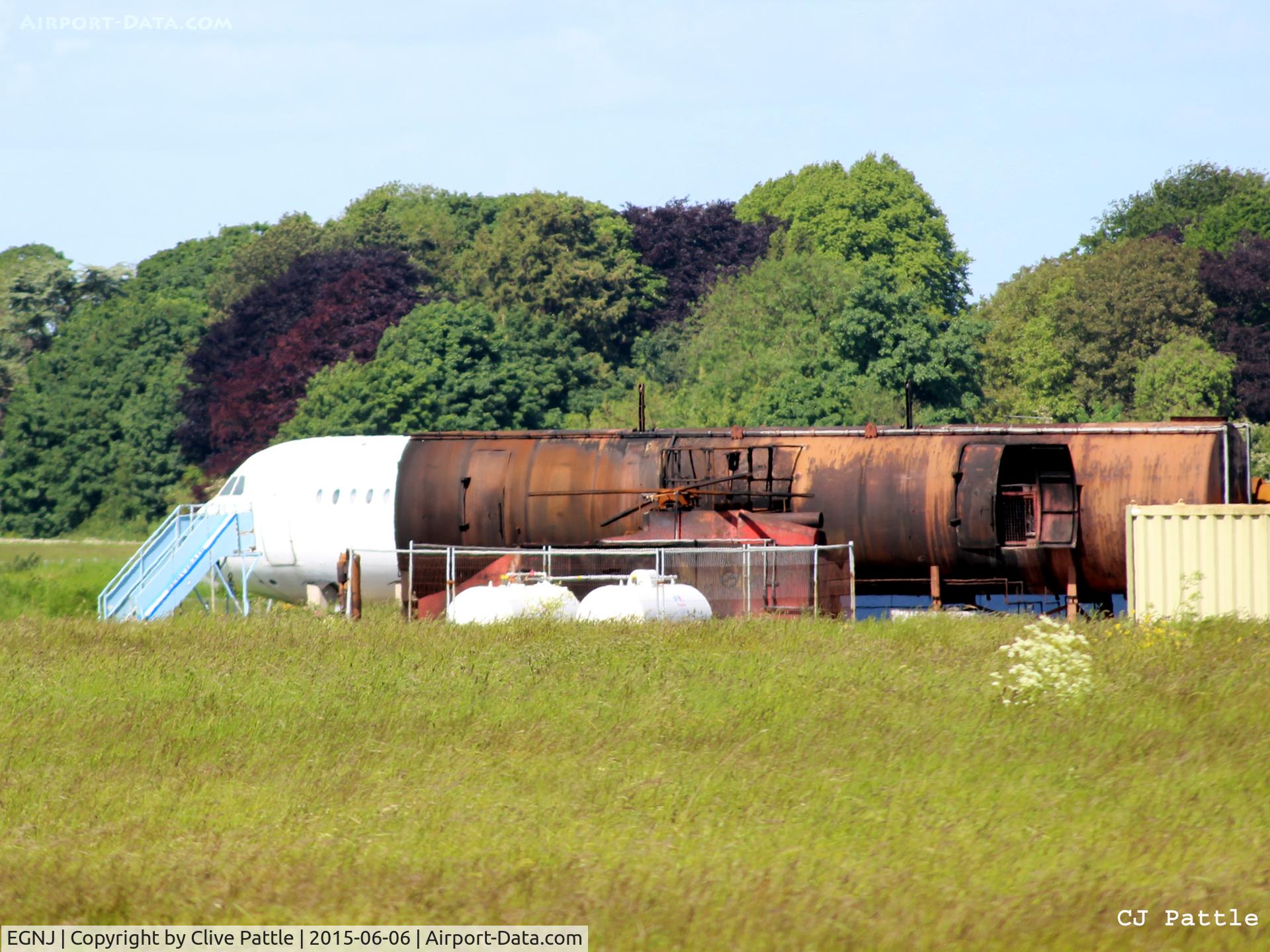 Humberside Airport, Kingston upon Hull, England United Kingdom (EGNJ) - Fire training area at Humberside EGNJ - note BAC 1-11 510ED G-AVMP fuselage in rear.