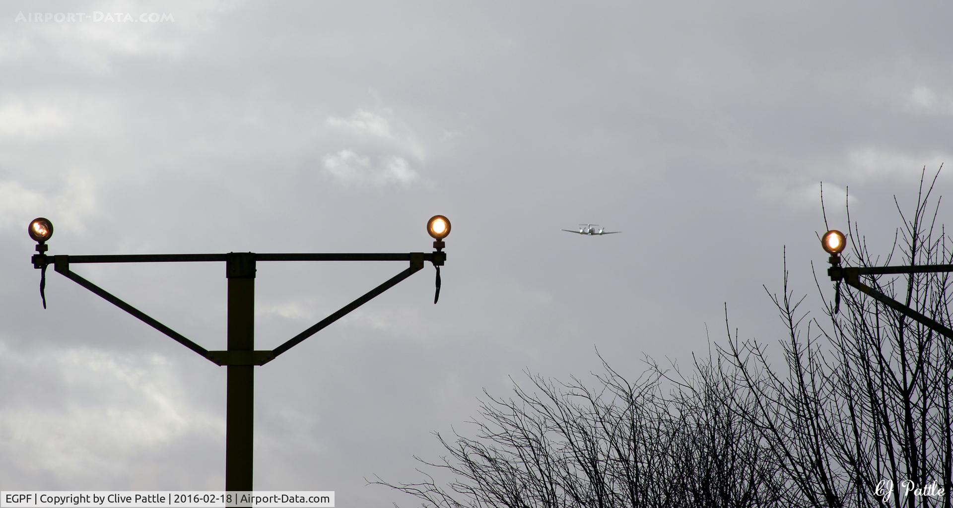 Glasgow International Airport, Glasgow, Scotland United Kingdom (EGPF) - Runway 23 approach lighting view at Glasgow International Airport EGPF - note Scottish Ambulance Beech King Air G-SASC departing in the distance