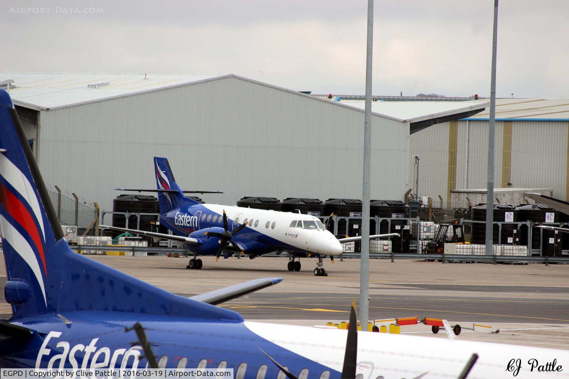 Aberdeen Airport, Aberdeen, Scotland United Kingdom (EGPD) - Eastern Airways apron at Aberdeen EGPD viewed from the multi-storey car park, charging 12p per minute to park there !