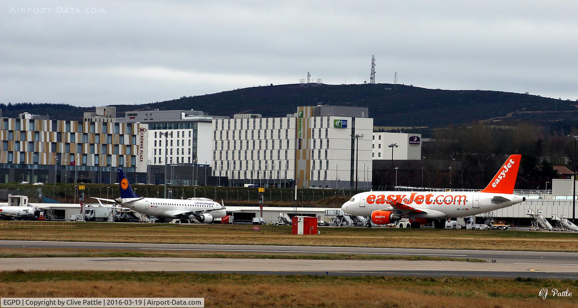 Aberdeen Airport, Aberdeen, Scotland United Kingdom (EGPD) - West side of airport and terminal showing mass of new hotels and industrial buildings - at Aberdeen EGPD
