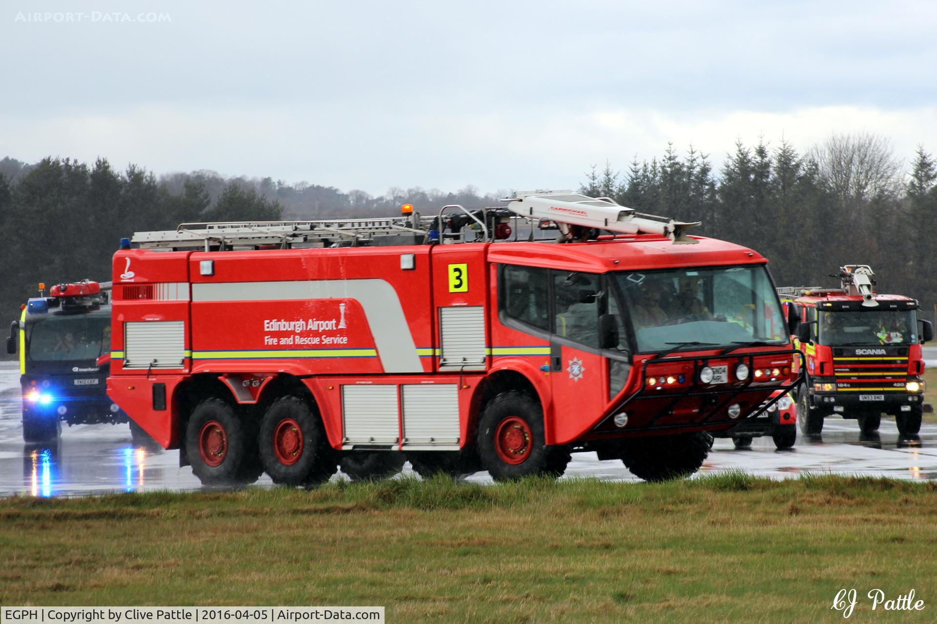 Edinburgh Airport, Edinburgh, Scotland United Kingdom (EGPH) - Fire/Rescue crews in real action. Seen escorting an aircraft to the gate at Edinburgh EGPH following a squawk 7700 'smoke in the cockpit' incident. See my aircraft photo G-LGNN from the same date.