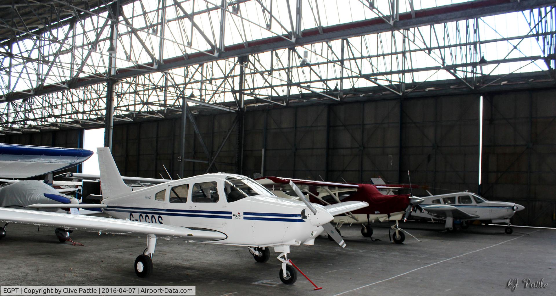 Perth Airport (Scotland), Perth, Scotland United Kingdom (EGPT) - General internal hangar view at Perth EGPT, highlighting the 1938 WWII roof construction, maximising on light and storage area.