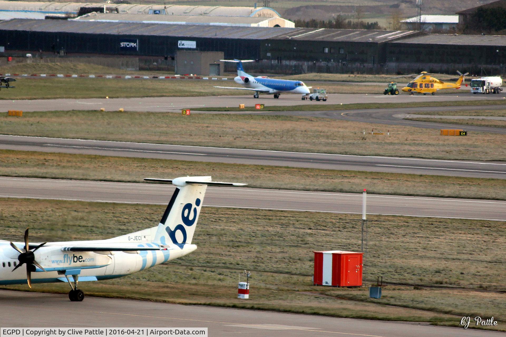 Aberdeen Airport, Aberdeen, Scotland United Kingdom (EGPD) - Aberdeen EGPD eastwards view - shows temp apron area for newly arrived NHV Helicopters - they are awaiting completion of their apron currently under construction.