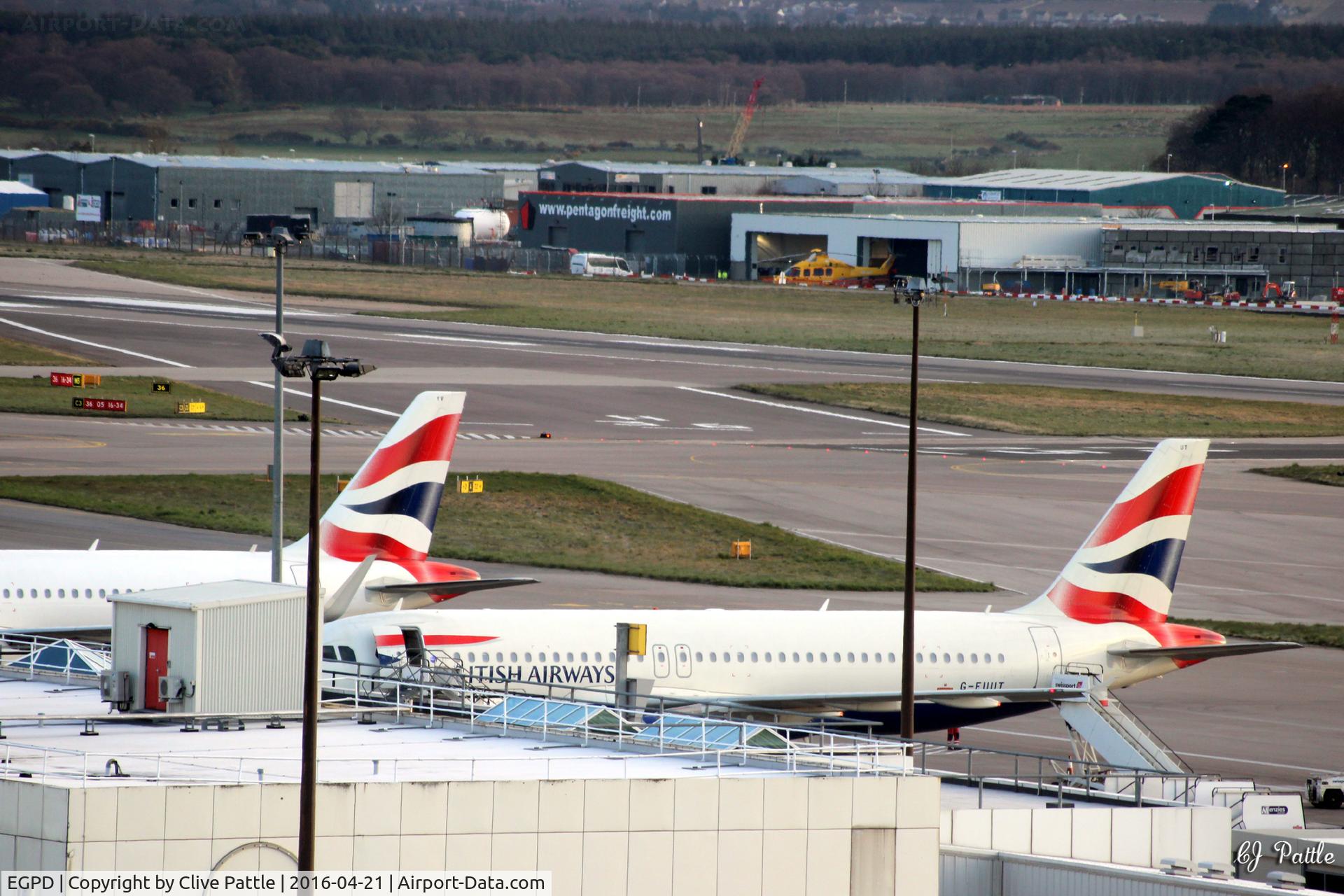 Aberdeen Airport, Aberdeen, Scotland United Kingdom (EGPD) - Section of the terminal at Aberdeen EGPD looking northwards - the white hangar in the background is now occupied by NHV Helicopters.