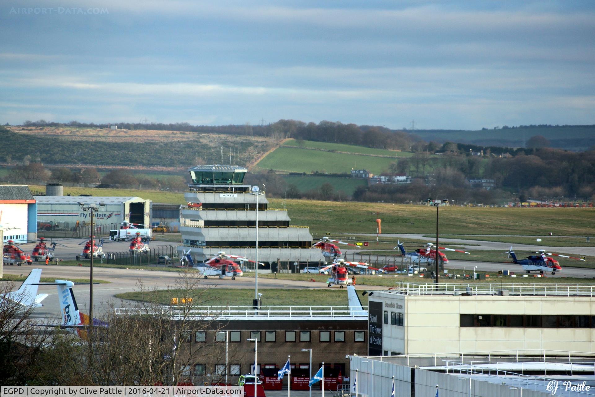 Aberdeen Airport, Aberdeen, Scotland United Kingdom (EGPD) - Aberdeen EGPD looking north in the early morning with a large number of CHC Scotia helicopters on the apron , ready for work.