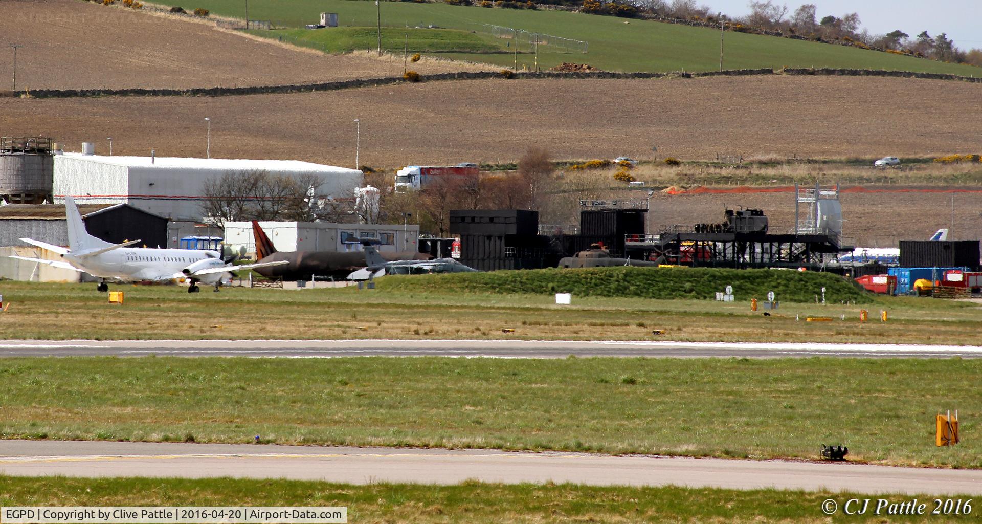 Aberdeen Airport, Aberdeen, Scotland United Kingdom (EGPD) - Fire and rescue training area at Aberdeen EGPD - if you look closely you will see a Sepecat Jaguar GR.3 and a H.P Jetstream in amongst the purpose built training aids.