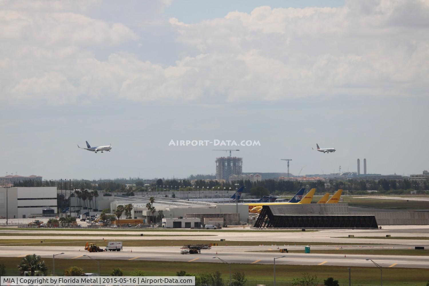 Miami International Airport (MIA) - Runway 9 being worked on while parallel landings occurring on 8L and R