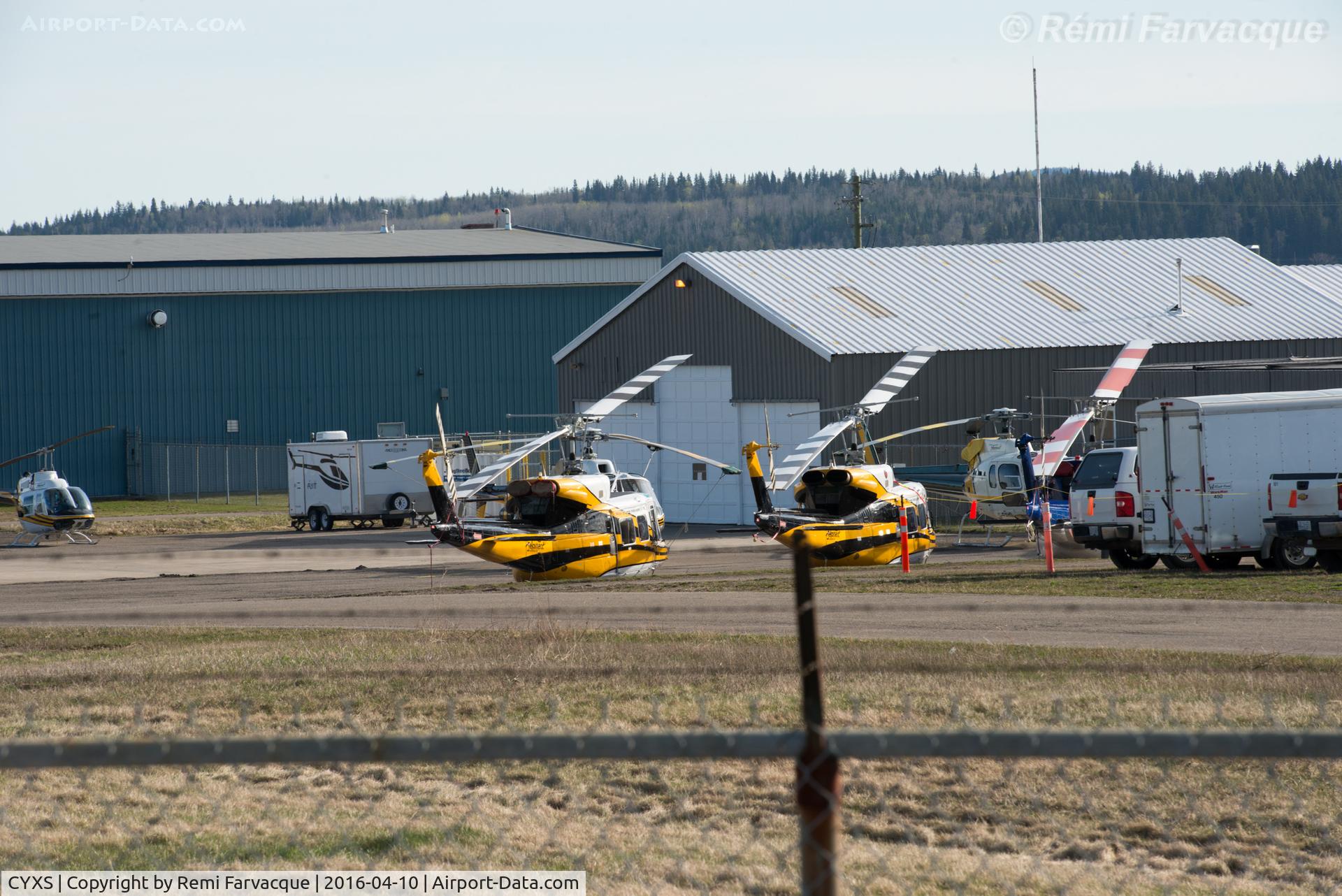 Prince George Airport, Prince George, British Columbia Canada (CYXS) - Just south of main terminal building. Helicopters ready to fight forest fires. 