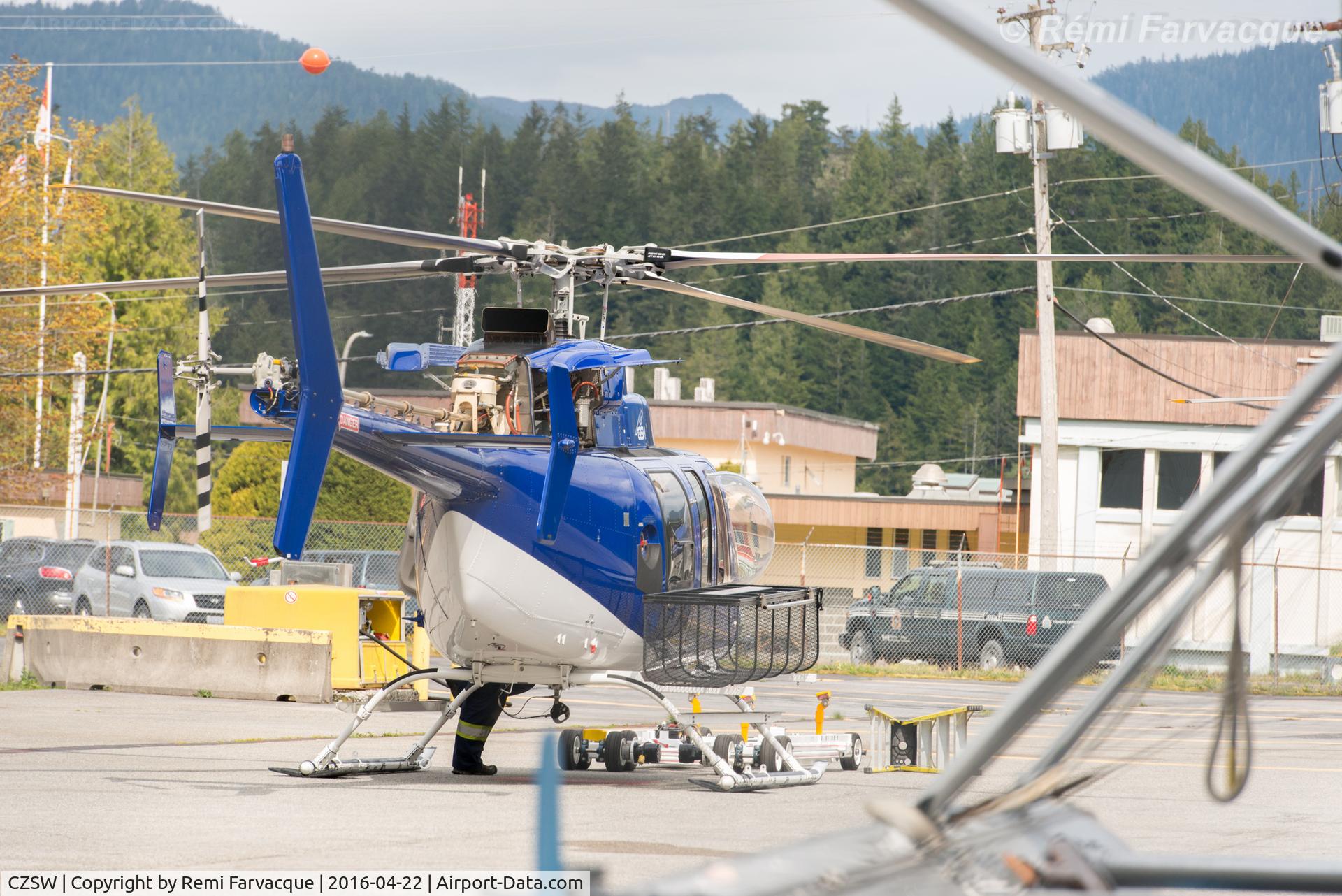 Prince Rupert/Seal Cove Water Airport, Prince Rupert, British Columbia Canada (CZSW) - Unknown helicopter in general setting of dry-land part of airport. Canadian Coast Guard base in background.