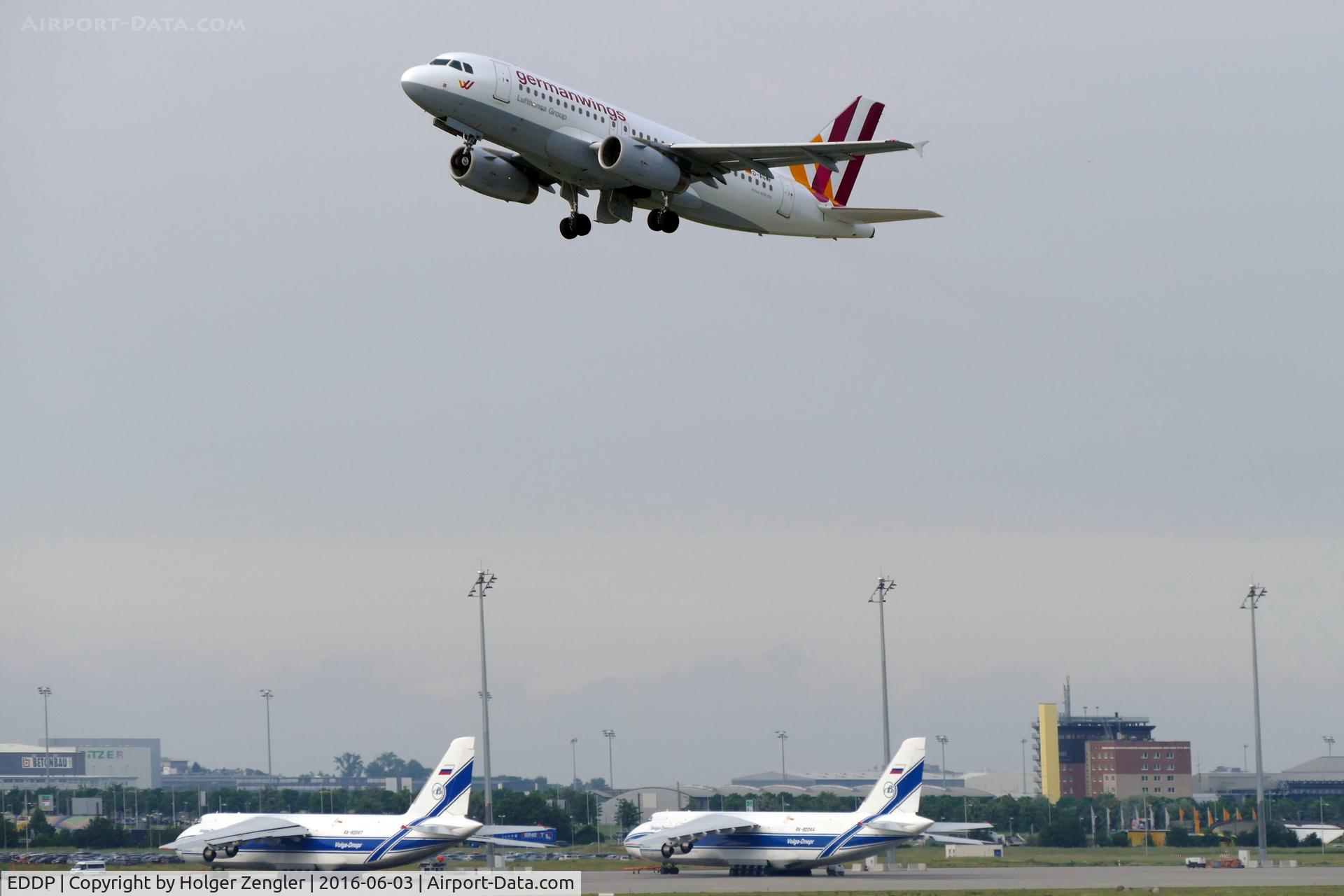 Leipzig/Halle Airport, Leipzig/Halle Germany (EDDP) - Morning shuttle to CGN is passing by big babies on apron 3...