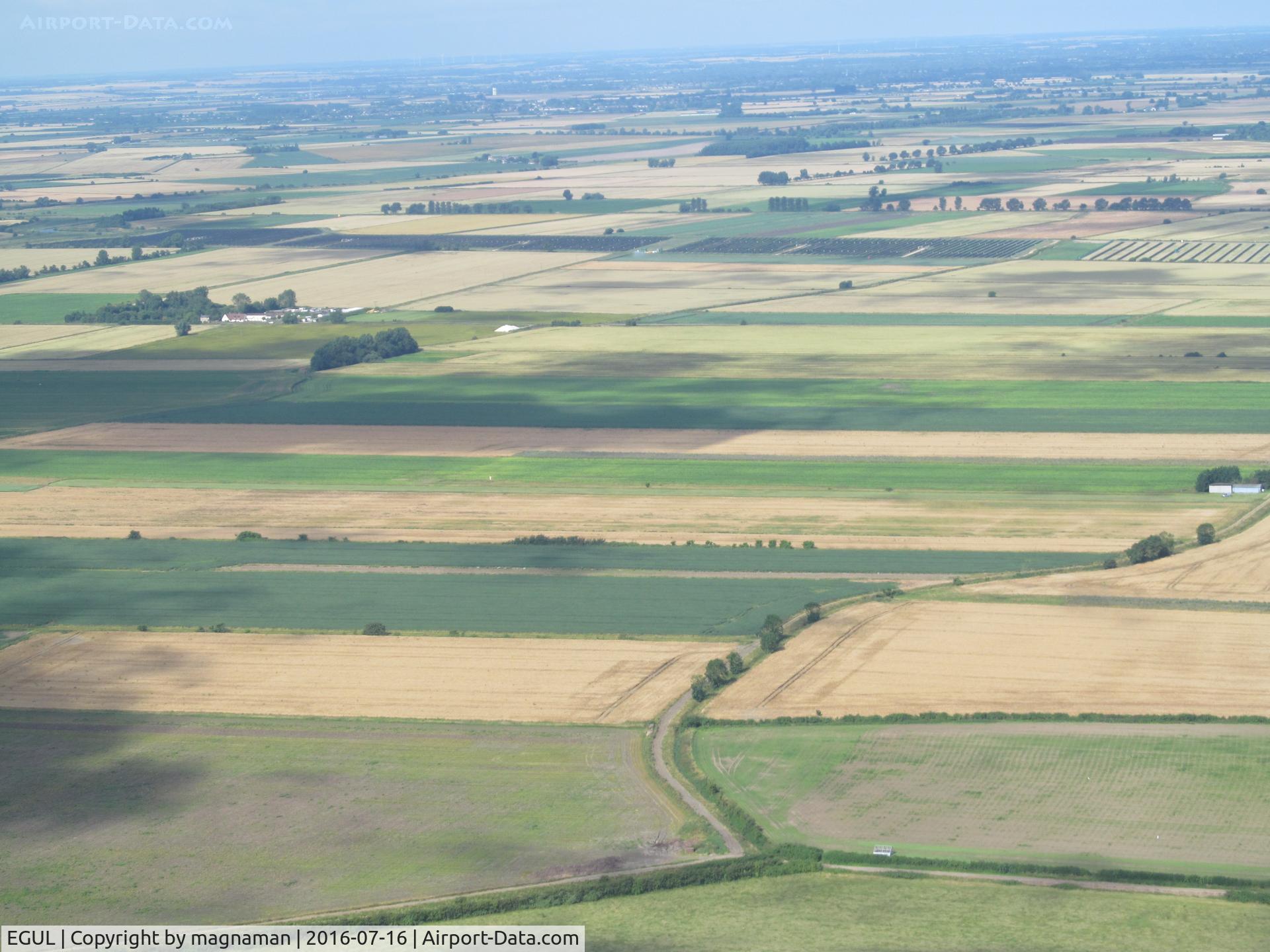 RAF Lakenheath Airport, Lakenheath, England United Kingdom (EGUL) - Actually Mitchells Farm strip near Wilburton not far from Lakenheath. Strip crosses left to right with hangar on right (north end) of strip
