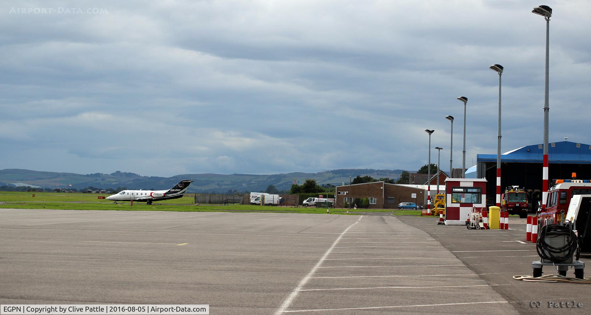 Dundee Airport, Dundee, Scotland United Kingdom (EGPN) - Main apron view looking west at Dundee Riverside airport EGPN. A visiting BJ400A OK-PPP is parked up.
