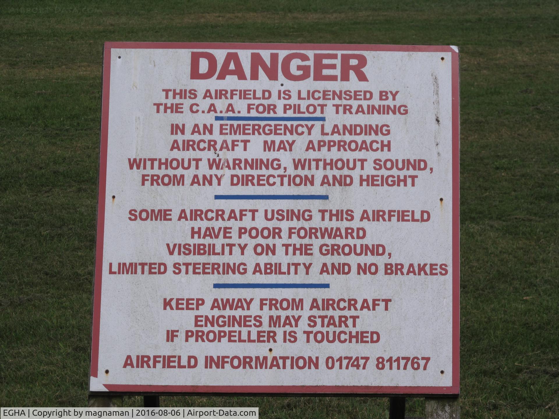 Compton Abbas Airfield Airport, Shaftesbury, England United Kingdom (EGHA) - sign next to public footpath style across runway!