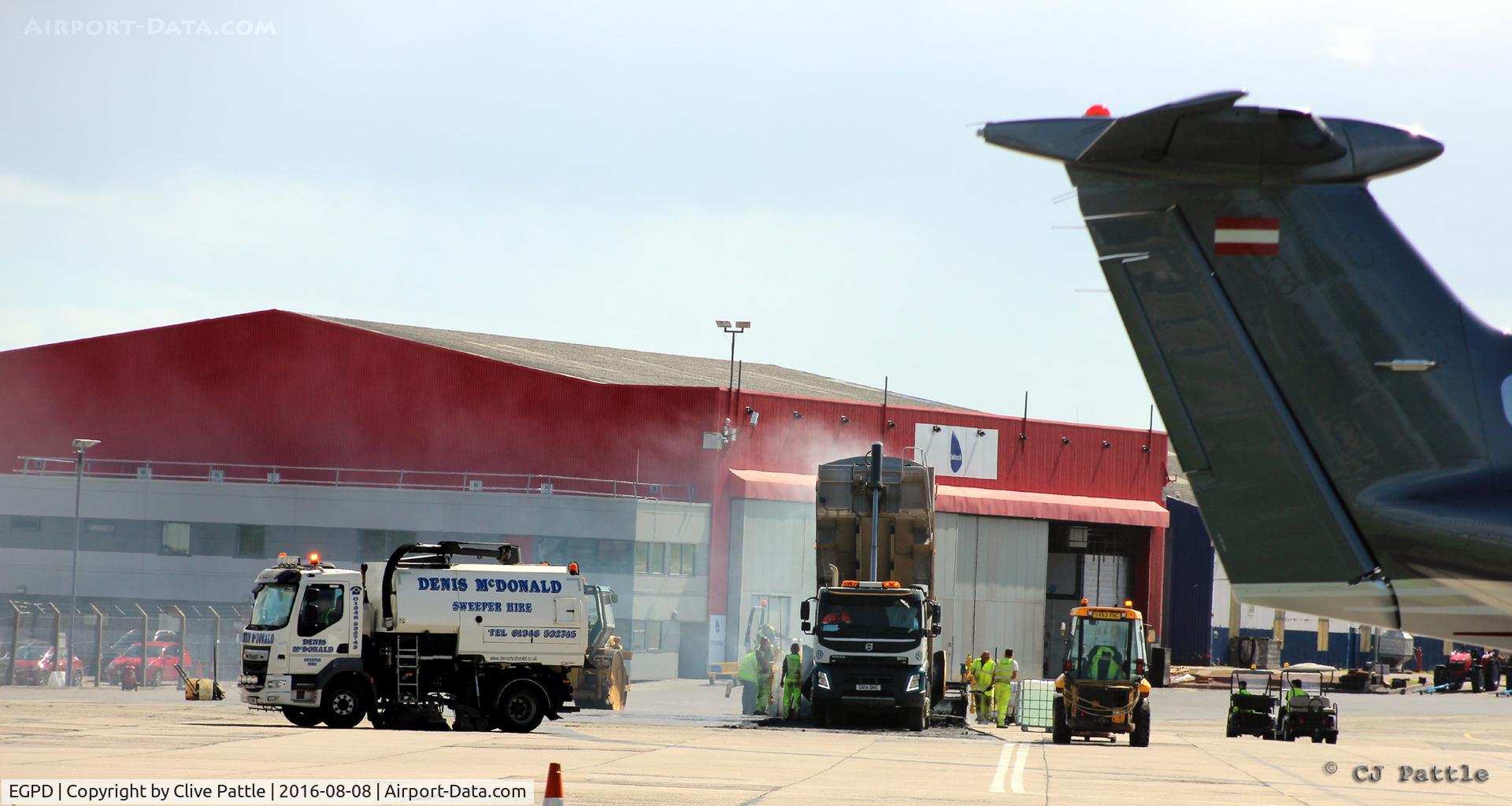 Aberdeen Airport, Aberdeen, Scotland United Kingdom (EGPD) - Re-surfacing work underway at the Babcock MCS Offshore (formerly Bond Helicopters) apron at Aberdeen