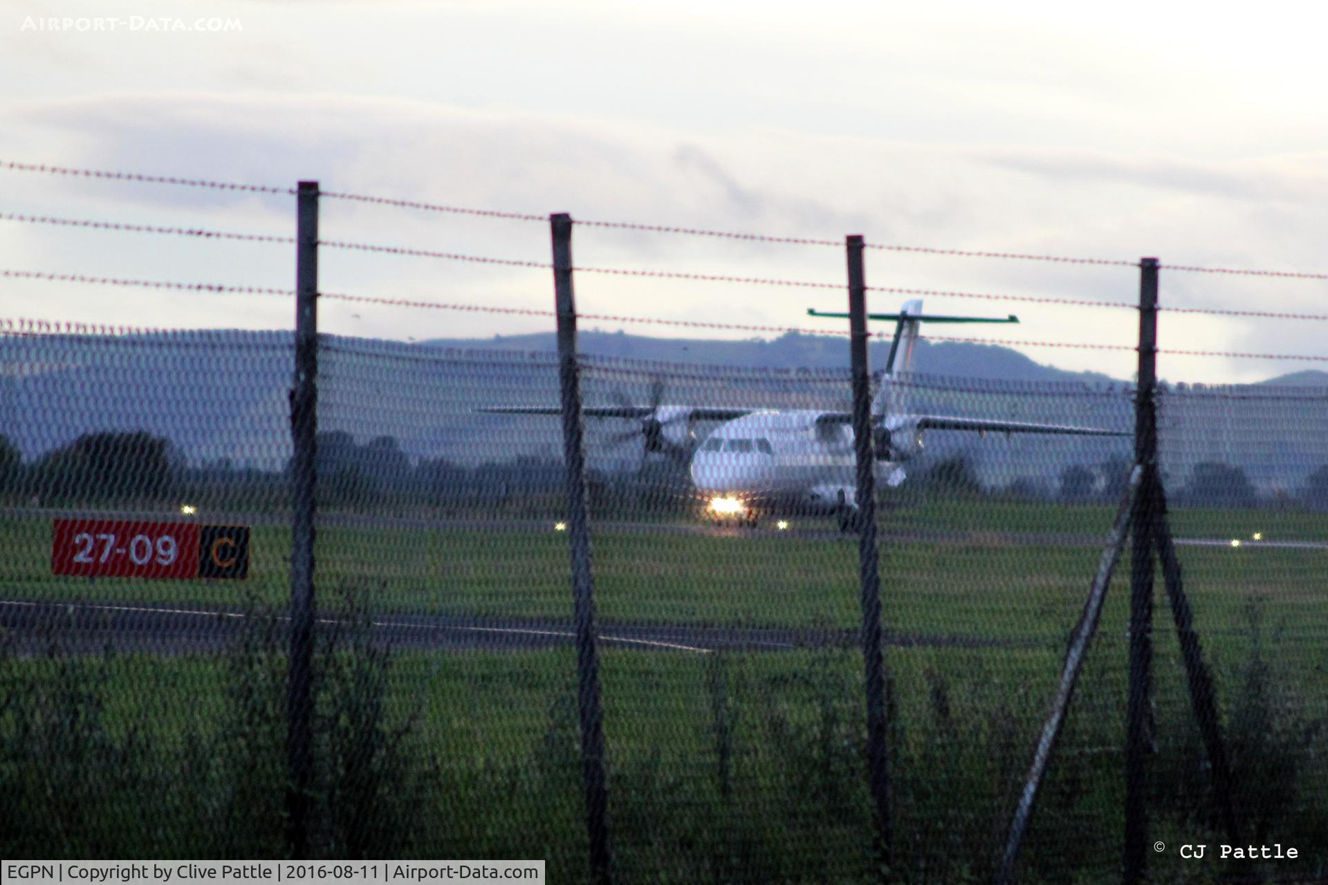 Dundee Airport, Dundee, Scotland United Kingdom (EGPN) - Through the fence shot in the failing light at Dundee EGPN - Dornier Do328-100 G-BYHG back tracks to the terminal.