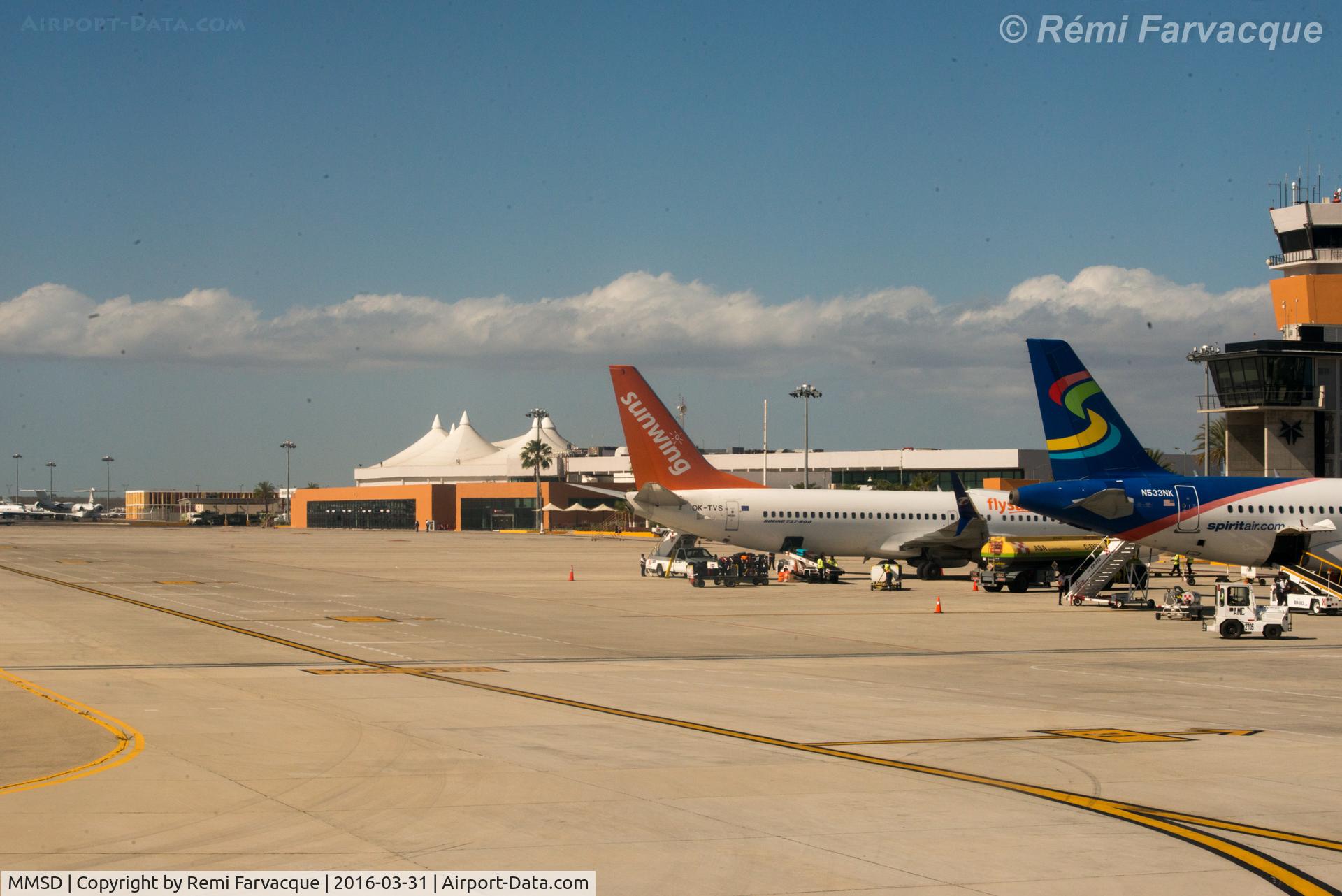 Los Cabos International Airport, Los Cabos, Baja California Sur Mexico (MMSD) - View of main parking area in front of terminal building as taxiing for take-off.