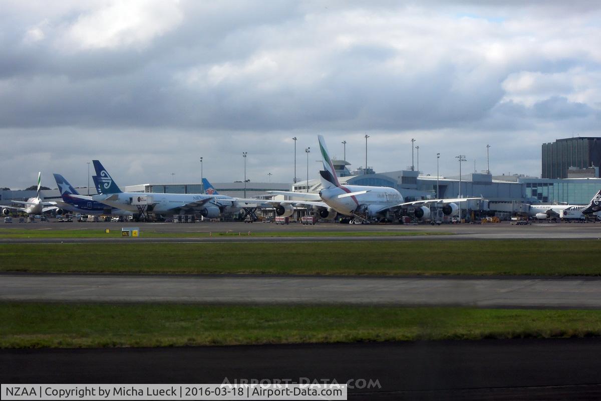 Auckland International Airport, Auckland New Zealand (NZAA) - Busy international terminal: 2 EK A380, LA B788, CZ 788, NZ 772, NZ A320