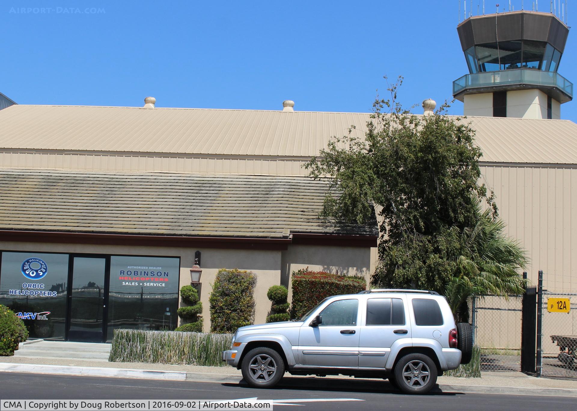Camarillo Airport (CMA) - ORBIC Helicopters-Robinson dealer, flight instruction and helicopter maintenance-near CMA Control Tower in background