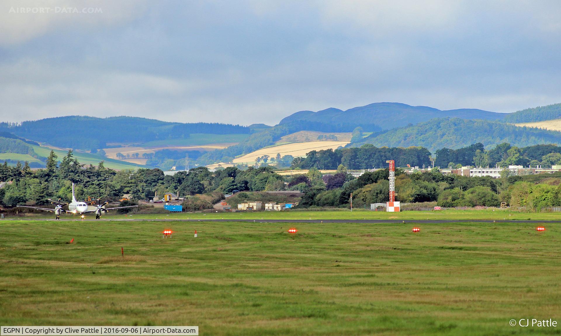 Dundee Airport, Dundee, Scotland United Kingdom (EGPN) - View westwards along Rwy 27 at Dundee EGPN, a Flybe/Loganair Saab 2000 backtracks to the terminal after arrival from Stansted EGSS