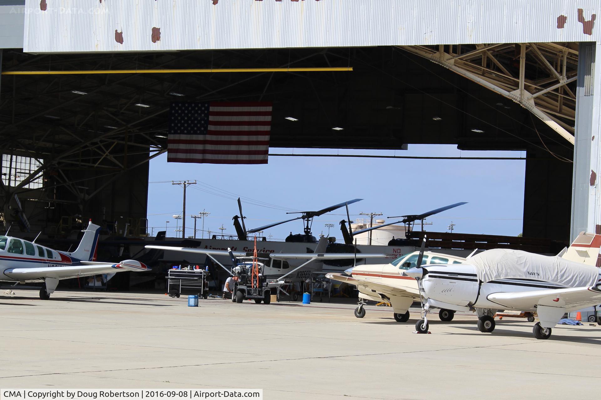 Camarillo Airport (CMA) - Camarillo Aircraft hangar, both ends open. Ventura County Sheriff's Helicopter unit is in western half, some helicopters shown. Usual takeoffs/landings from adjacent ramp. Now in 2019 Sheriff/Ventura County Fire  has total hangar.