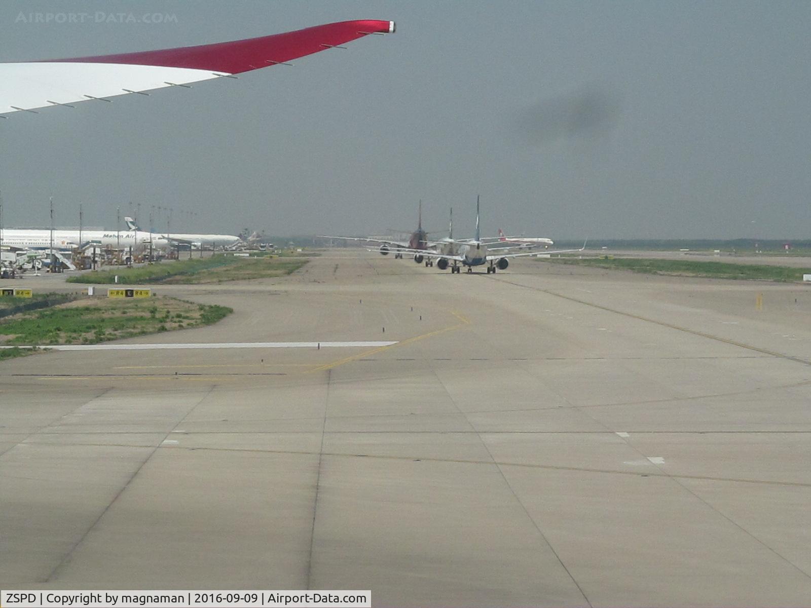 Shanghai Pudong International Airport, Shanghai China (ZSPD) - planes taxying in at PVG