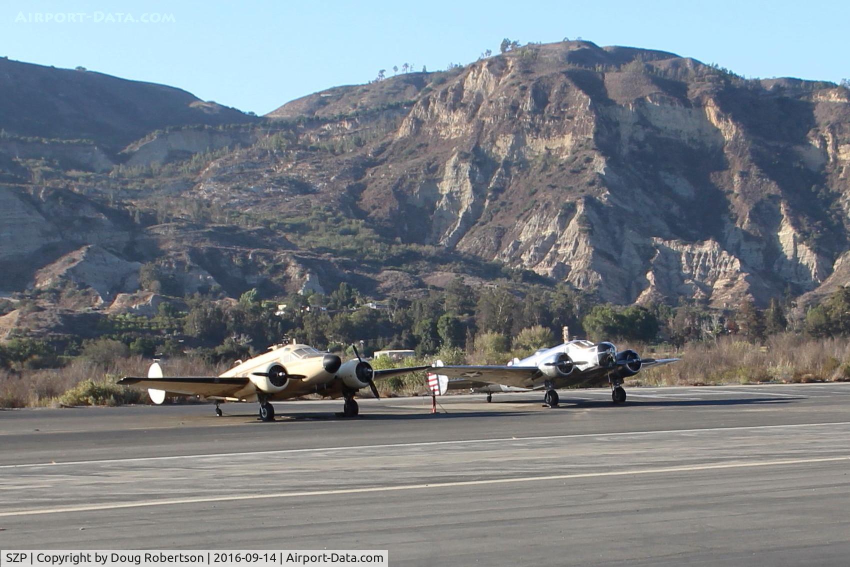 Santa Paula Airport (SZP) - A couple of twin Beech 18 variants. N5644D an E18S based at SZP & N15KK, a US Army Air Corps AT-11 bombing practice trainer side by side near SZP Helipad. Unusual to see two twin Beech 18 variants together here. See N15KK photos.