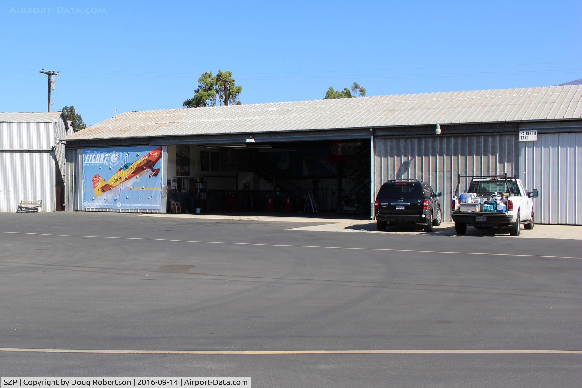 Santa Paula Airport (SZP) - 24 Beech Taxi, Home hangar of N669AJ, a modified, customized Extraflugzeugproduktions EA330/SC. Single seat short wing version Experimental class, one-off? See N669AJ aircraft photos.