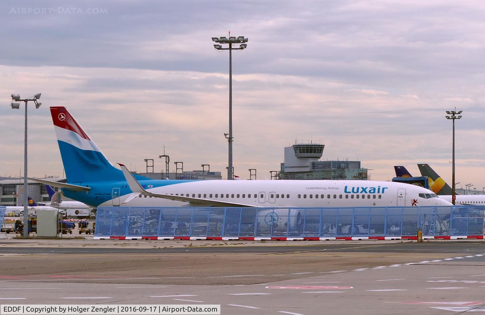 Frankfurt International Airport, Frankfurt am Main Germany (EDDF) - Please imagine what colors the fence in front of an Emirates jet might have....
