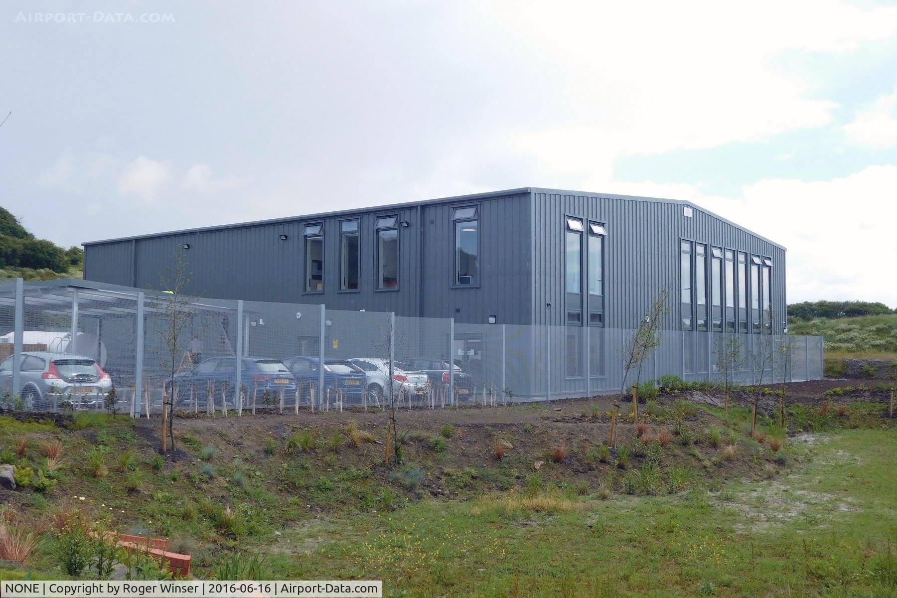 NONE Airport - Hangar for two air ambulance helicopters (G-WASN and G-HEMN) at the new Wales Air Ambulance base at Dafen, Llanelli, Wales, UK.