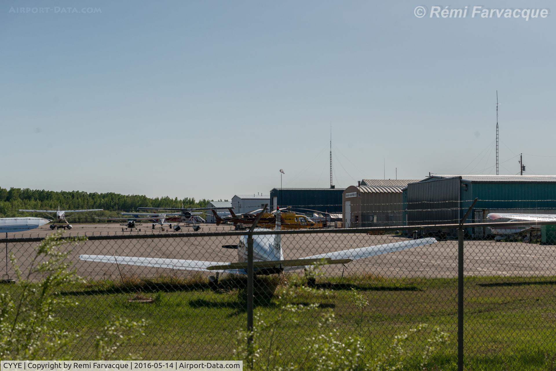 Fort Nelson Airport, Fort Nelson, British Columbia Canada (CYYE) - View to south from northernmost portion of airport. Privater and corporate hangars.