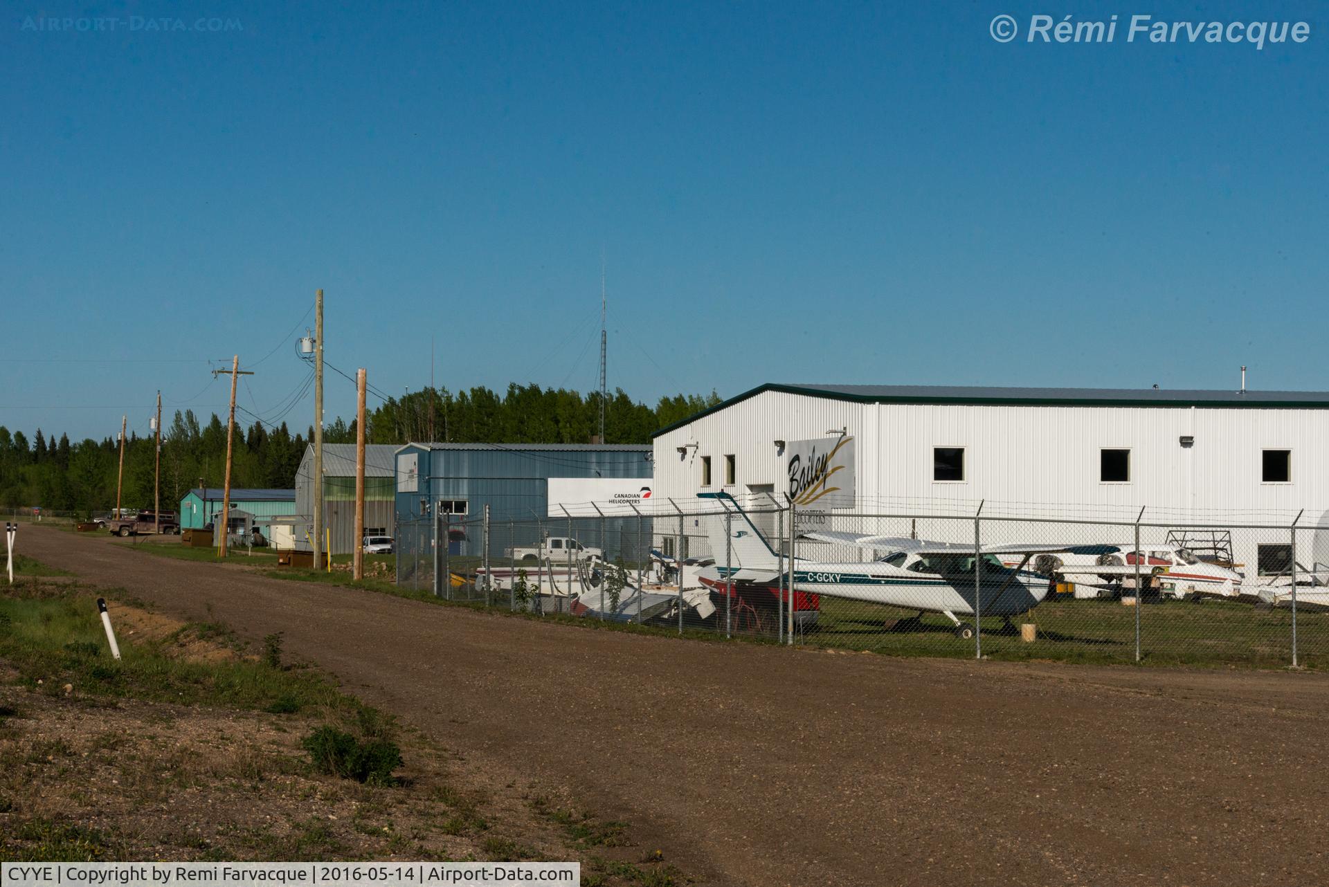 Fort Nelson Airport, Fort Nelson, British Columbia Canada (CYYE) - View north down access road to private / corporate hangers, northeast portion of airport.