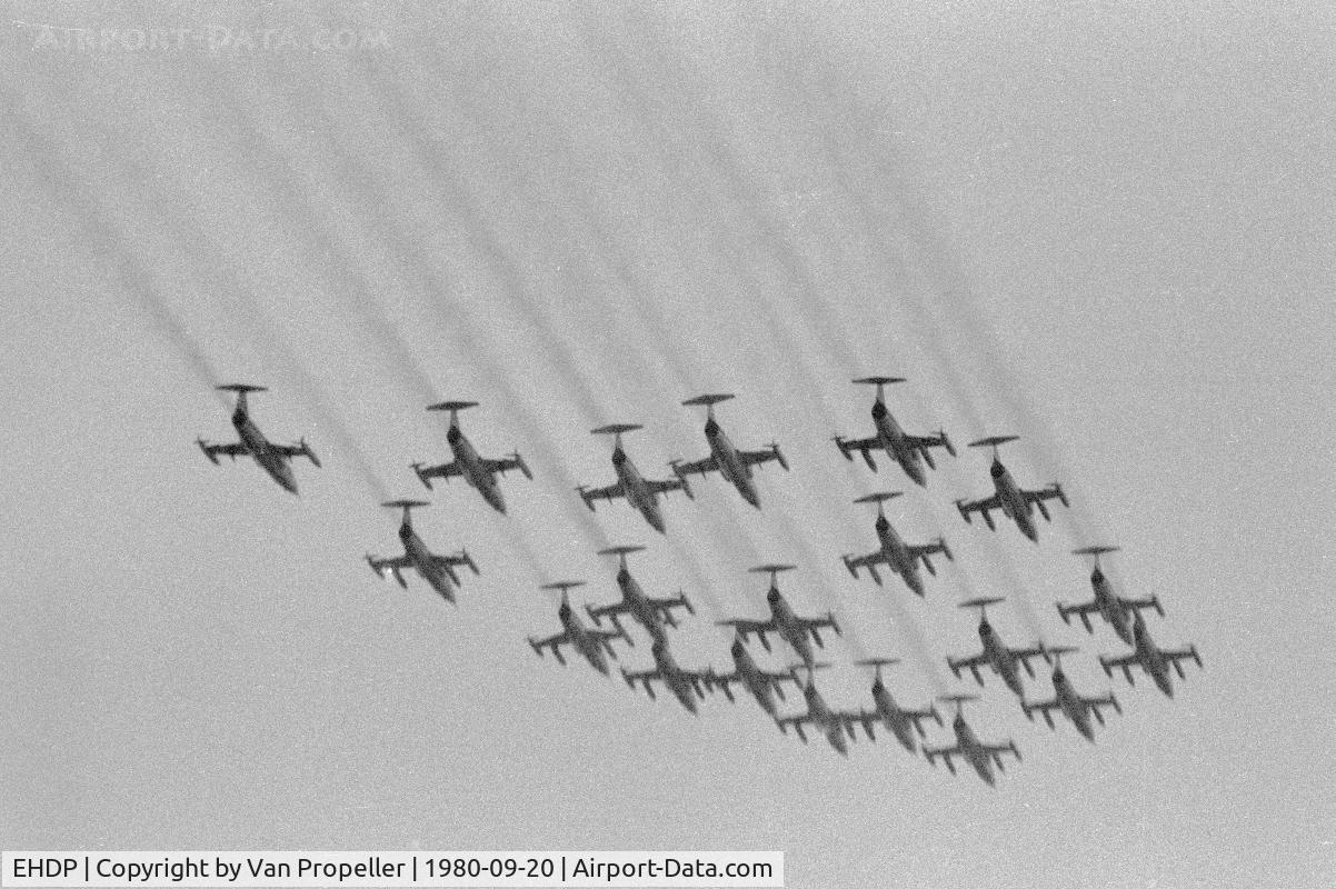 De Peel Airport, Venraij Netherlands (EHDP) - Smoky fly past of 20 Starfighters during the 1980 Royal Netherlands Air Force Open Day at De Peel air base