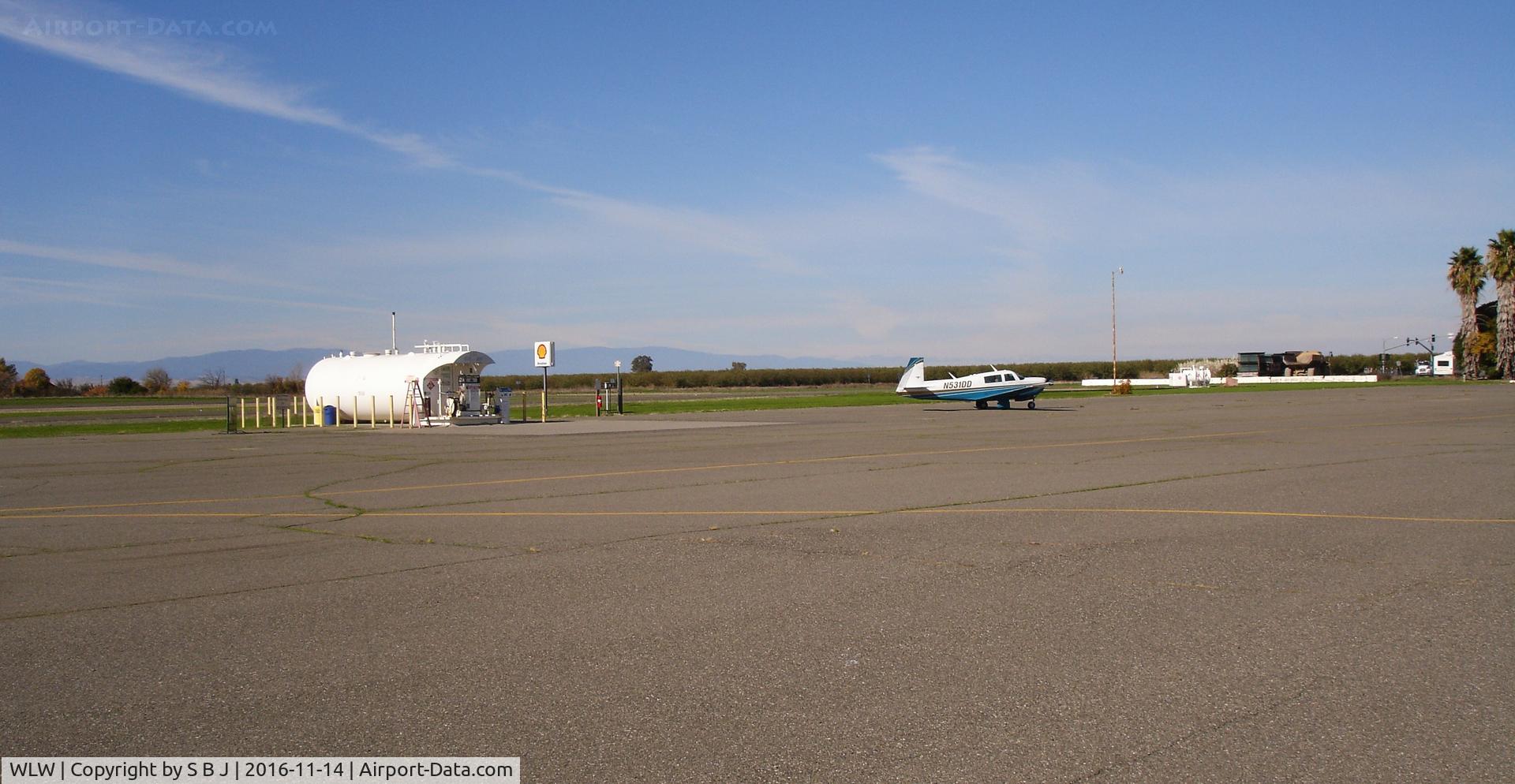 Willows-glenn County Airport (WLW) - Mooney 1DD seen as it taxied from the fuel island. View is to the NW.